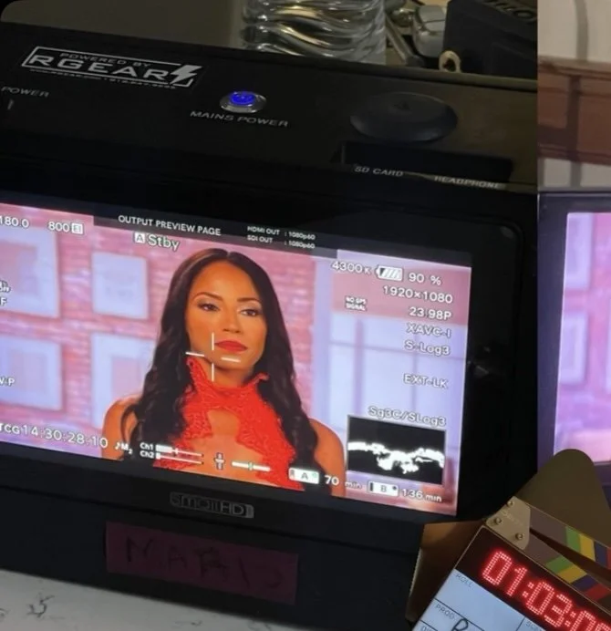 Coley on set, on-screen modeling still