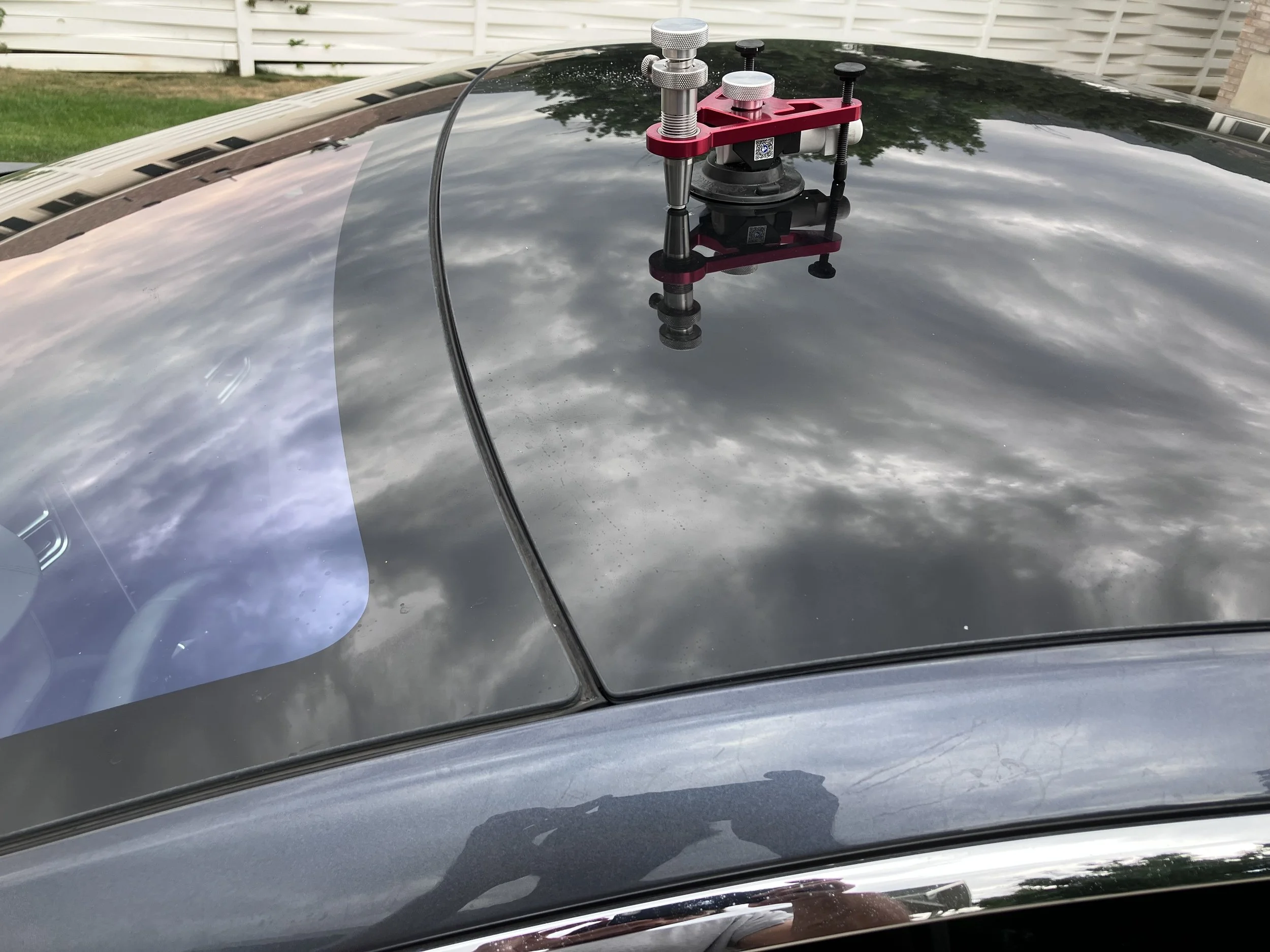 Rock chip repair on a Tesla panoramic glass roof in South Ogden, Utah