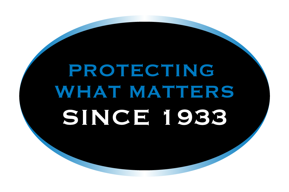 Logo with black oval background, blue and white text reading "Protecting What Matters Since 1933".