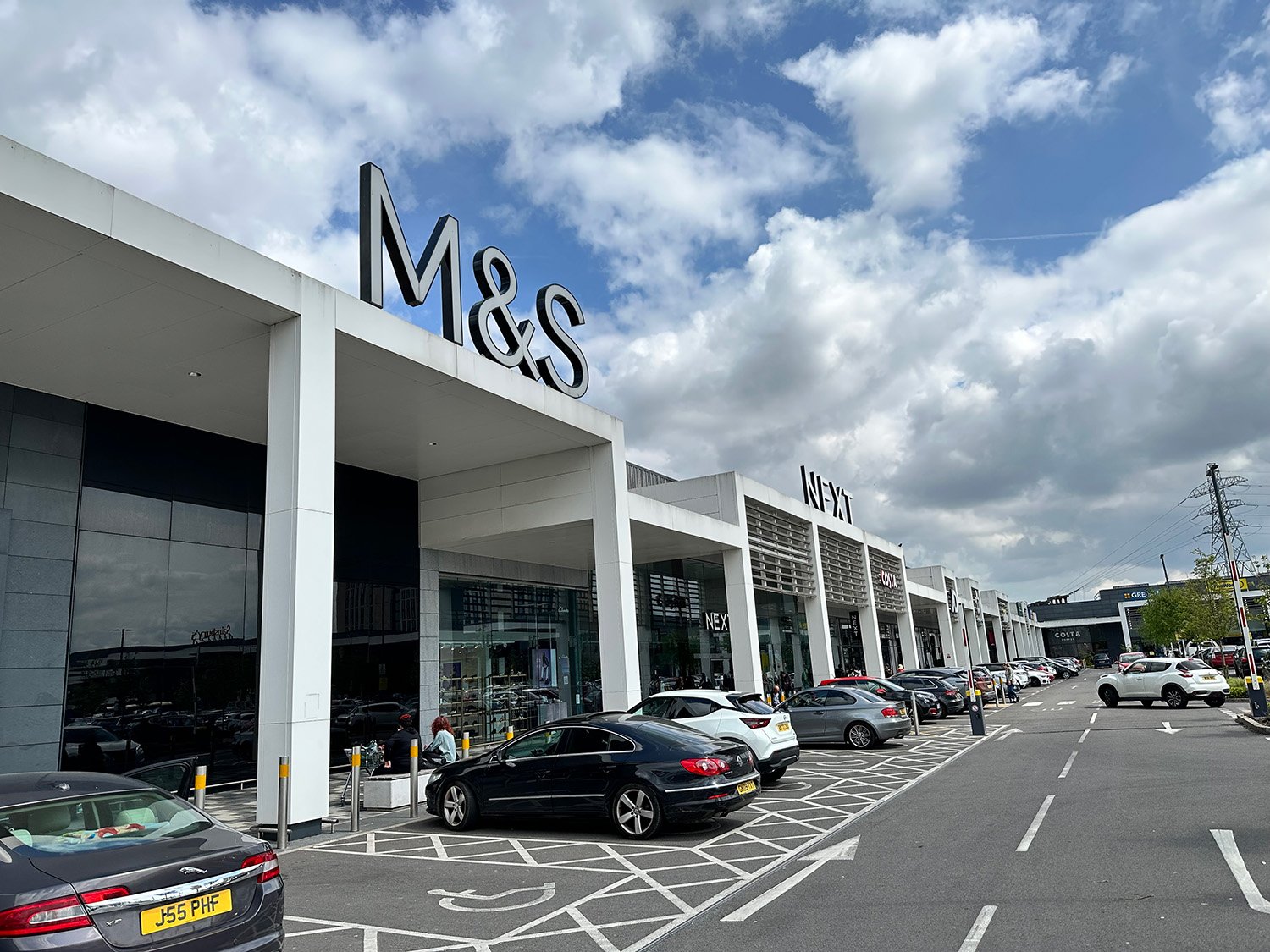 large retail shopping building with blue sky