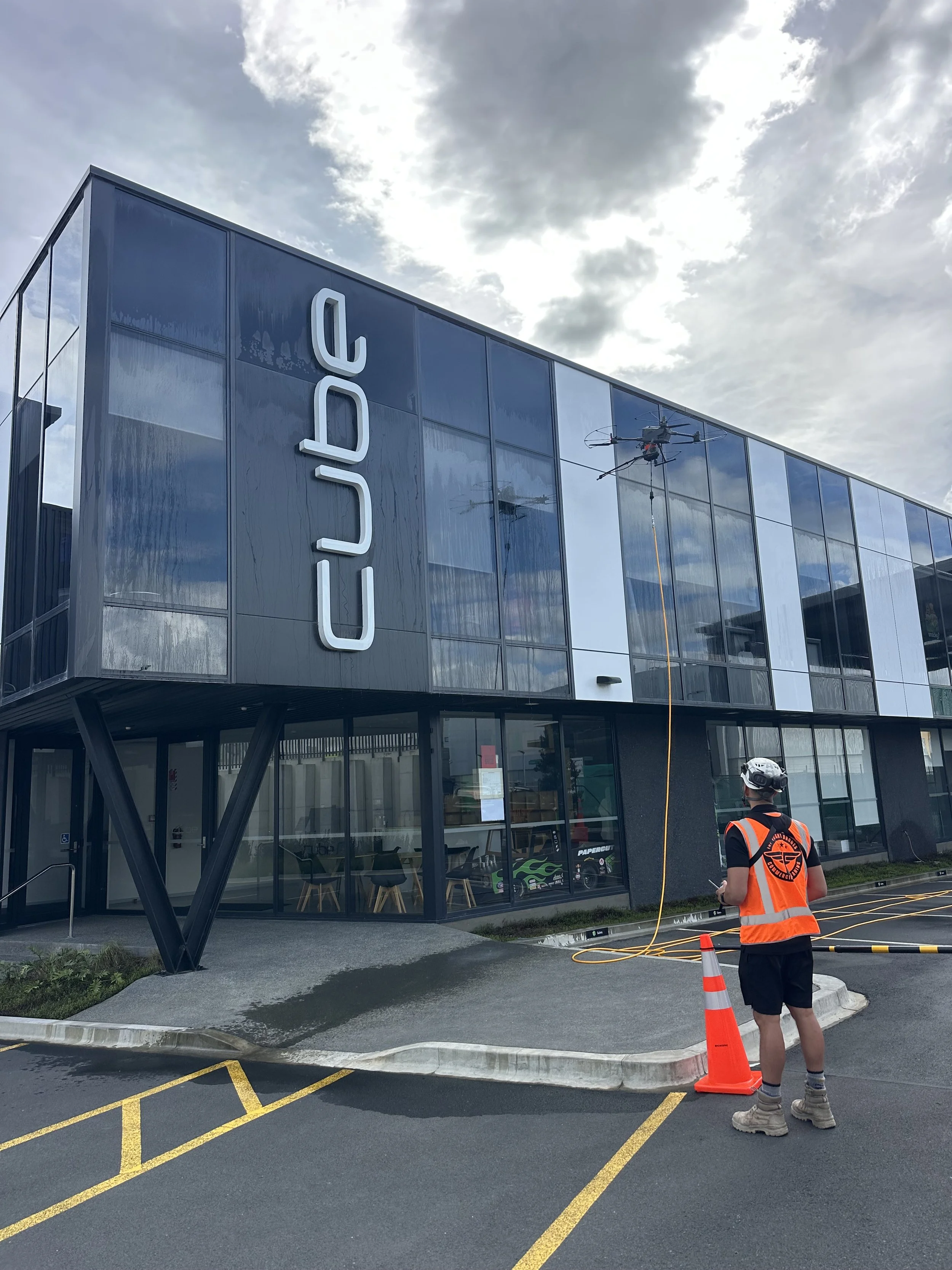 Drone cleaning glass building