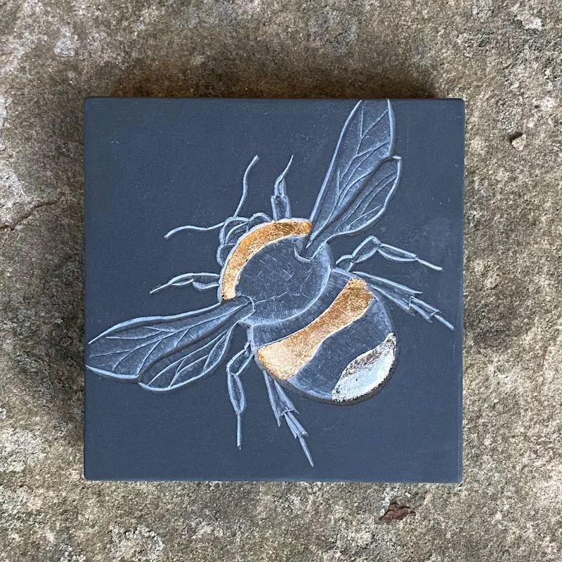 Bee on Welsh slate by Louise Tiplady
