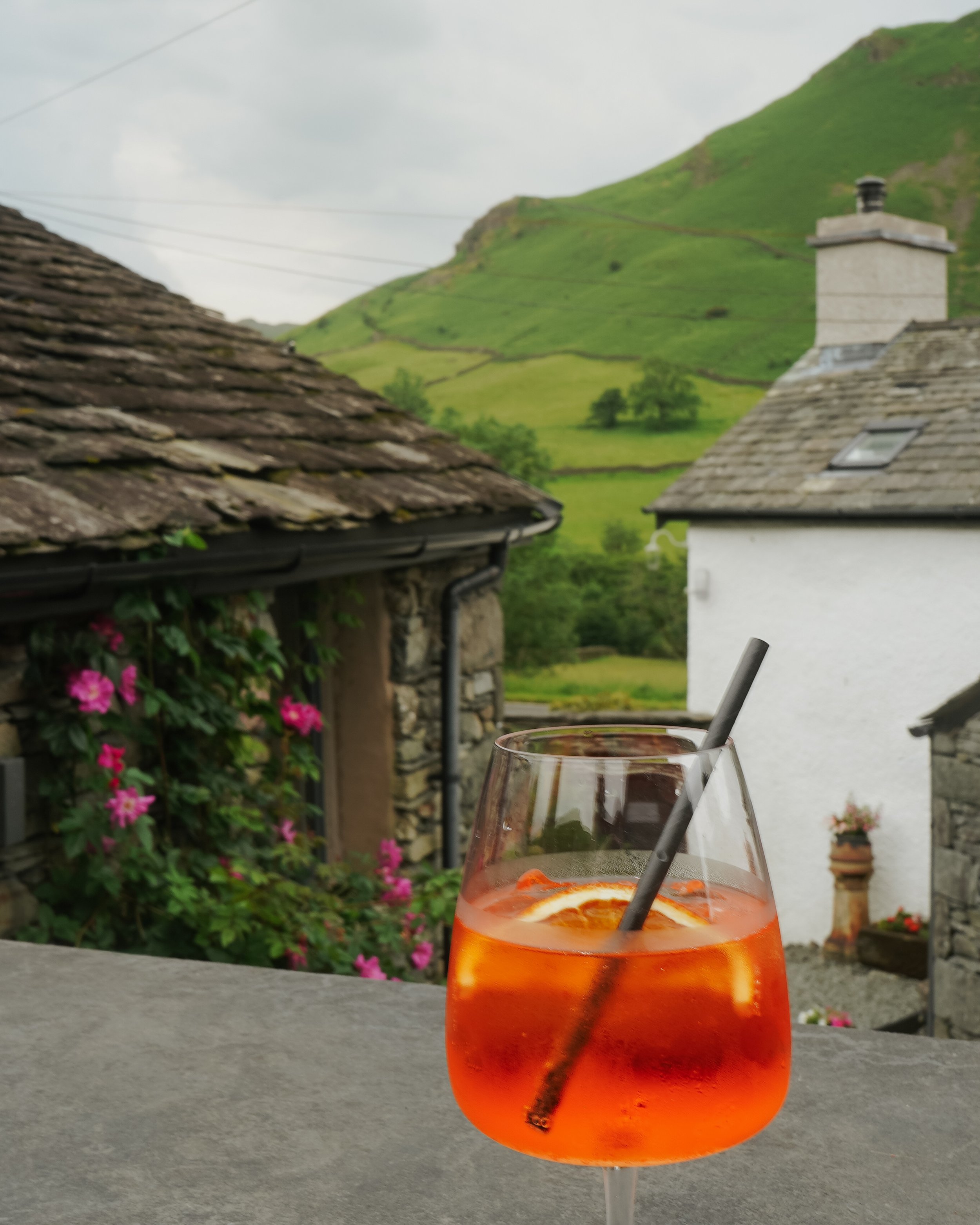 An aperol spritz on the terrace at The Yan at Broadrayne overlooking the mountains