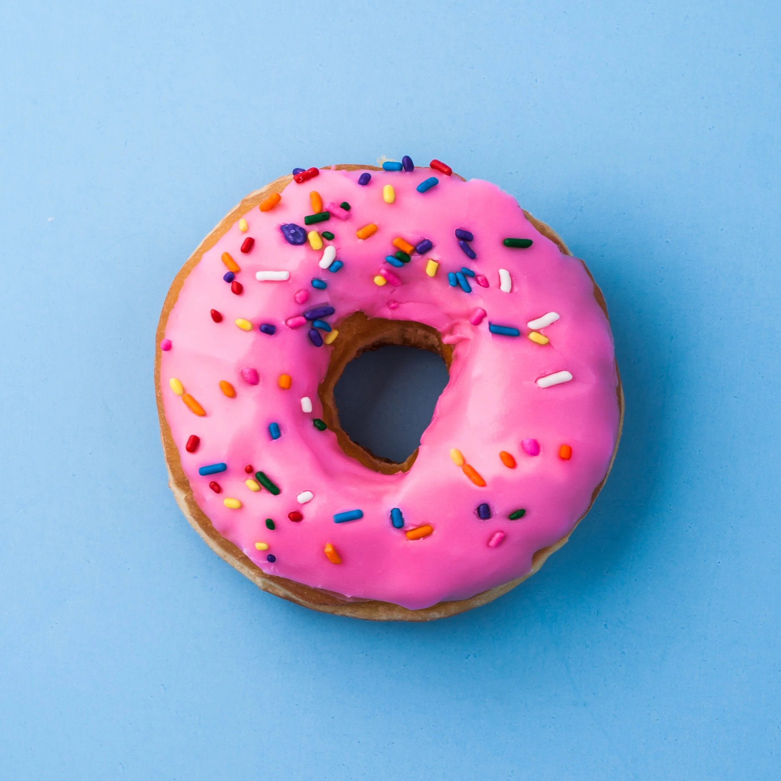 pink donut on blue background
