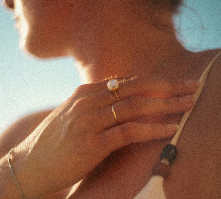 close up of rings on woman's fingers