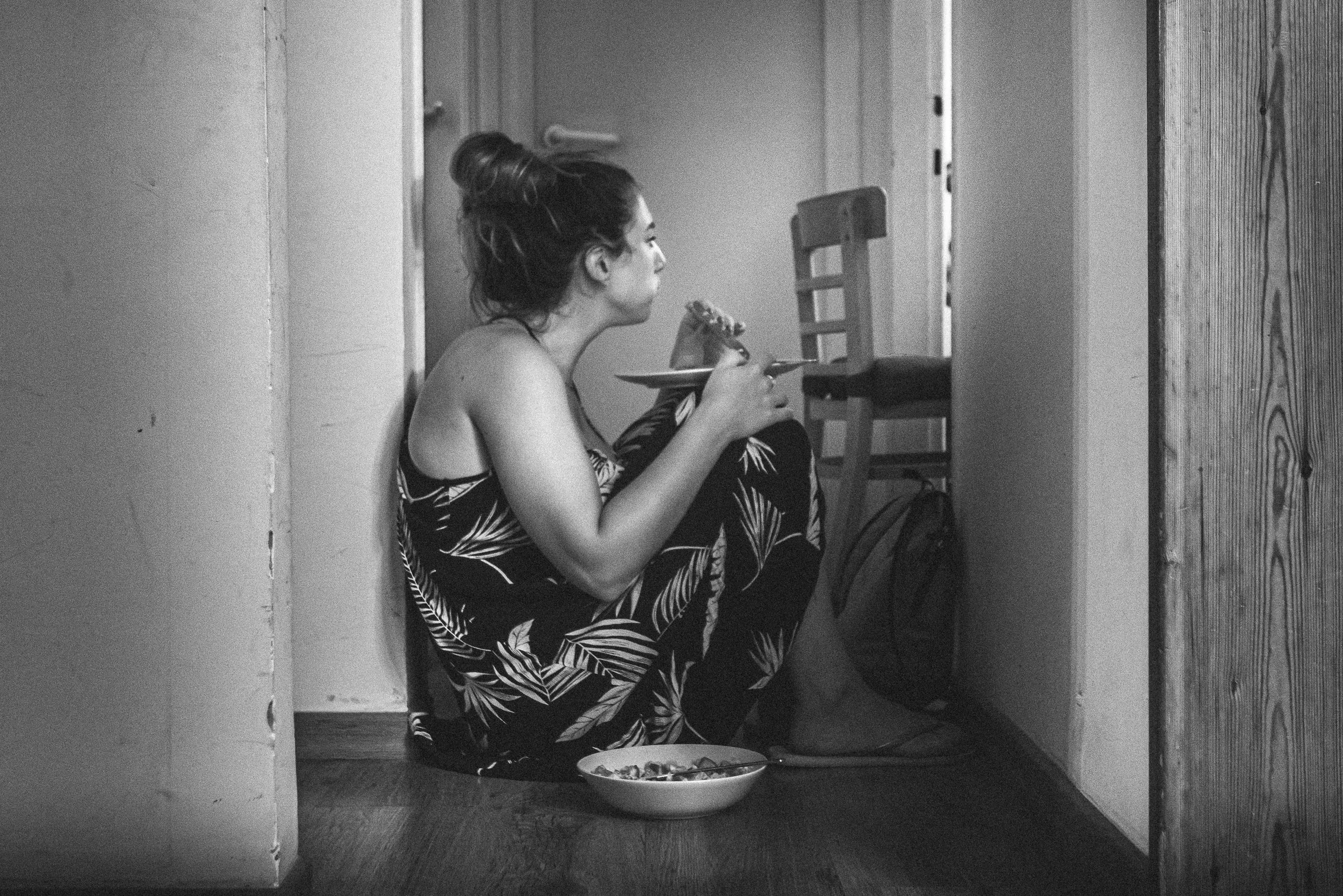 woman sitting on floor emotional eating