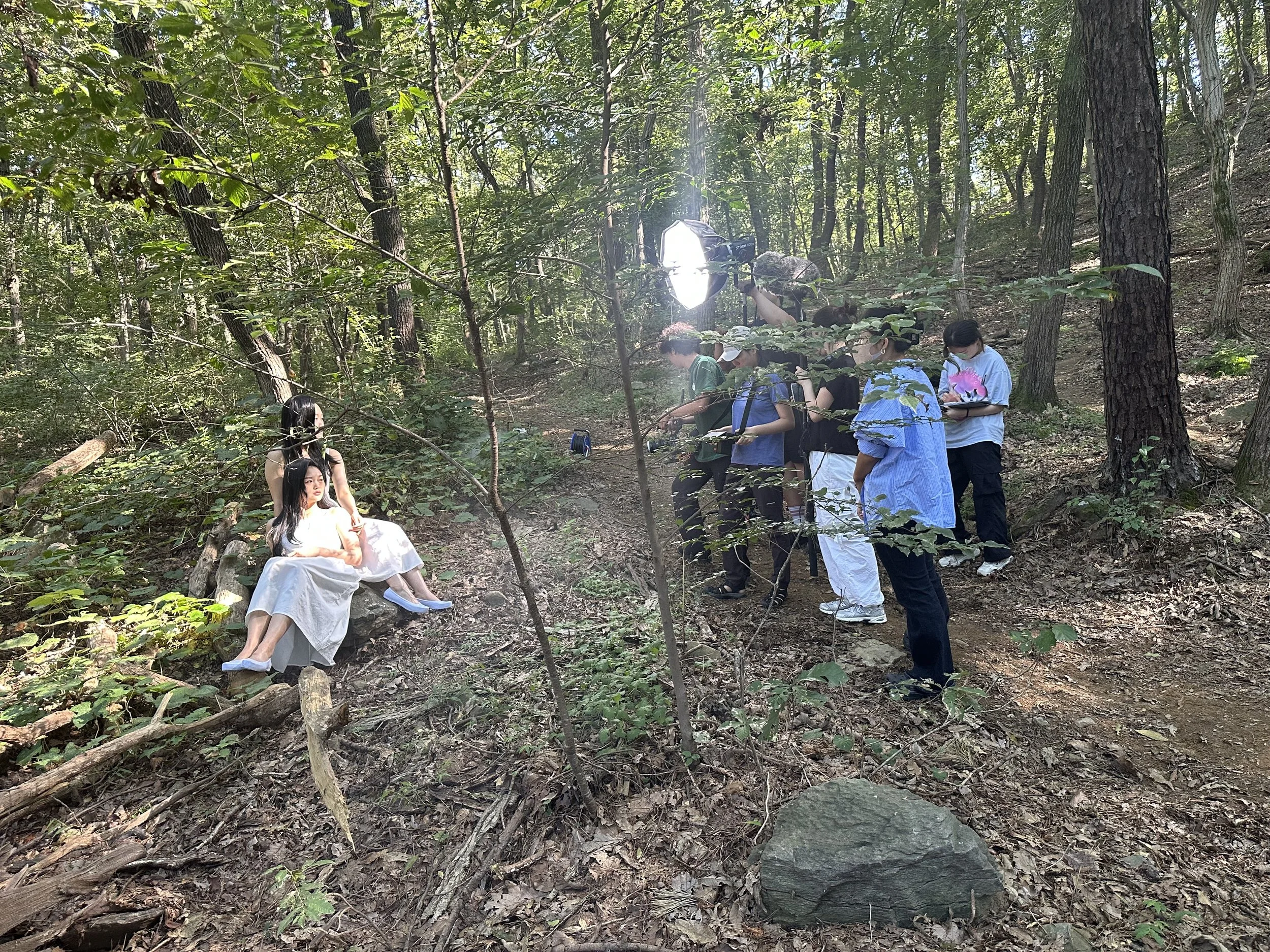 Swipe Right To Bite/SRTB behind the scenes/BTS. Jiseo (Yeon) and Kyunghee (Sol) in the forest scene. Production team/crew working.