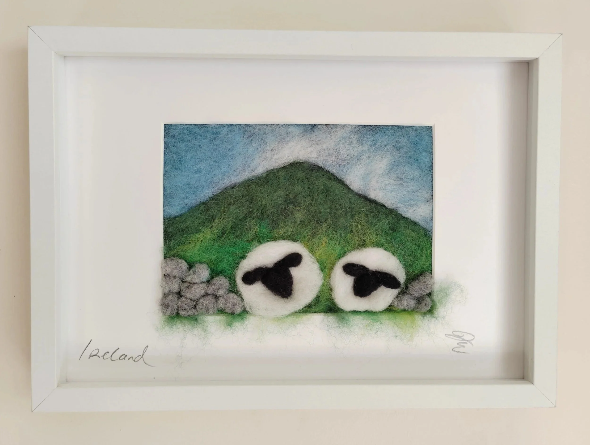 Sheep Emerging Through a Broken Stone Wall – Felted Picture