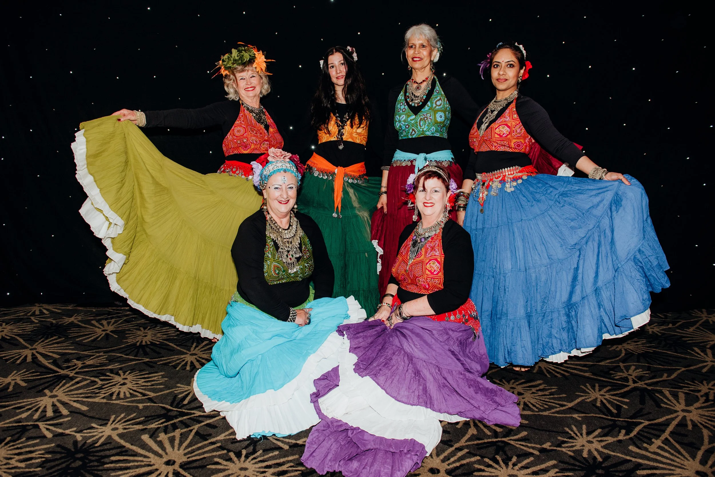 Gypsophilia poses with their colorful skirts after their Limelight 2025 performance