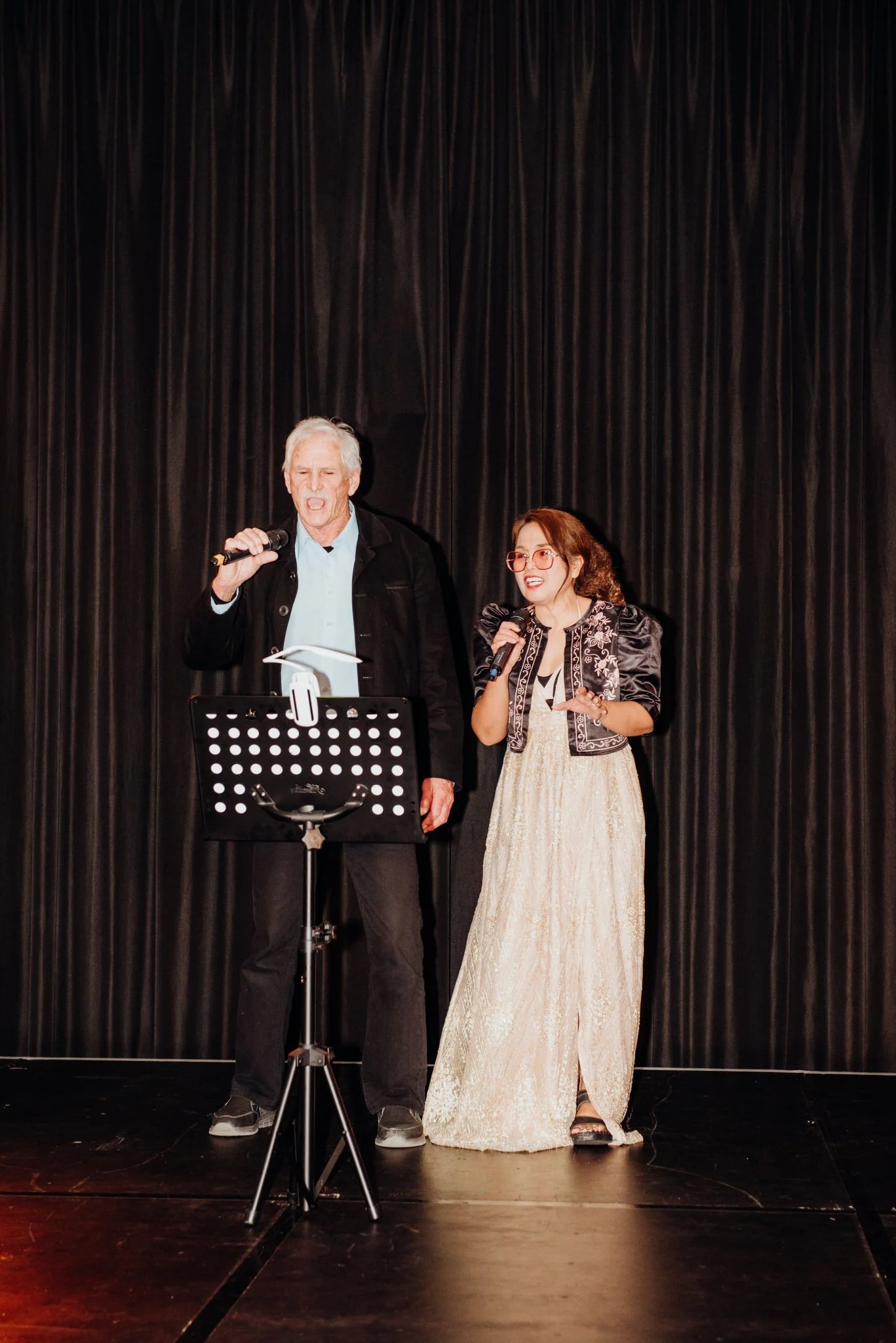 Emily and Julian singing a duet on stage at Limelight 2025.