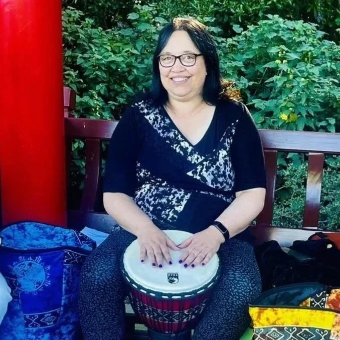 Keri Elvin playing one of her many drums