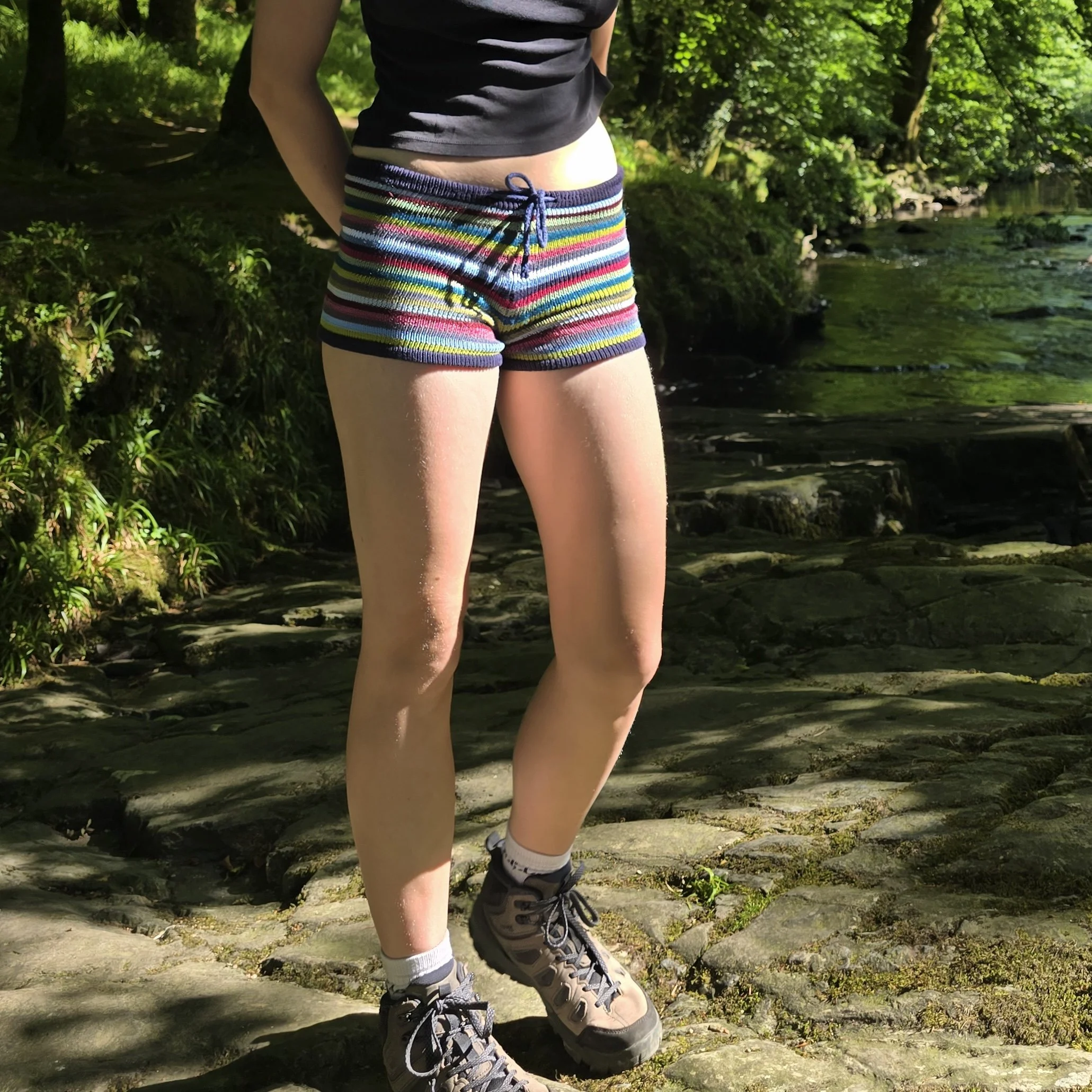 Handmade multicolour striped knitted shorts with drawstring ties and comfy waistband, trendy Y2K boho hippy fairycore style for girly fashion lovers.