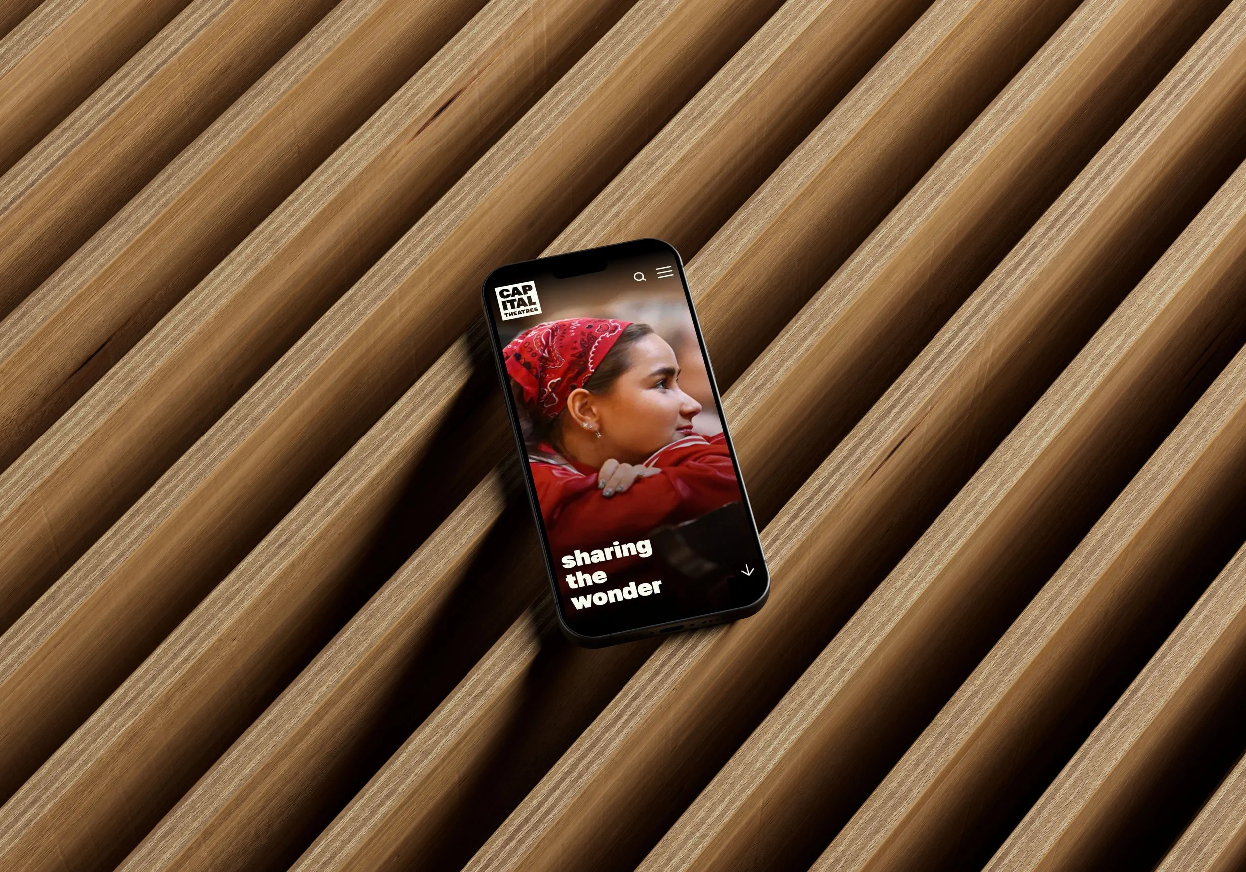 An image of Capital Theatres homepage on a mobile device.