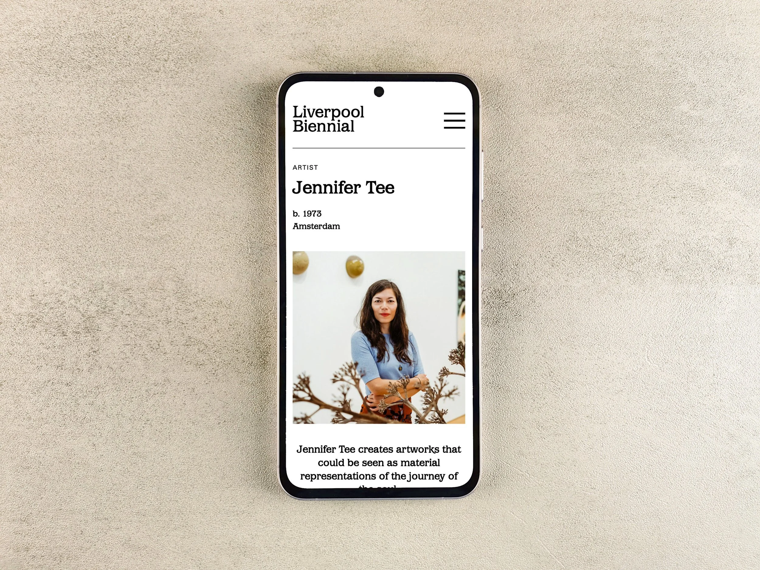 Visual of a mobile device displaying an artist page on the Liverpool Biennial website.
