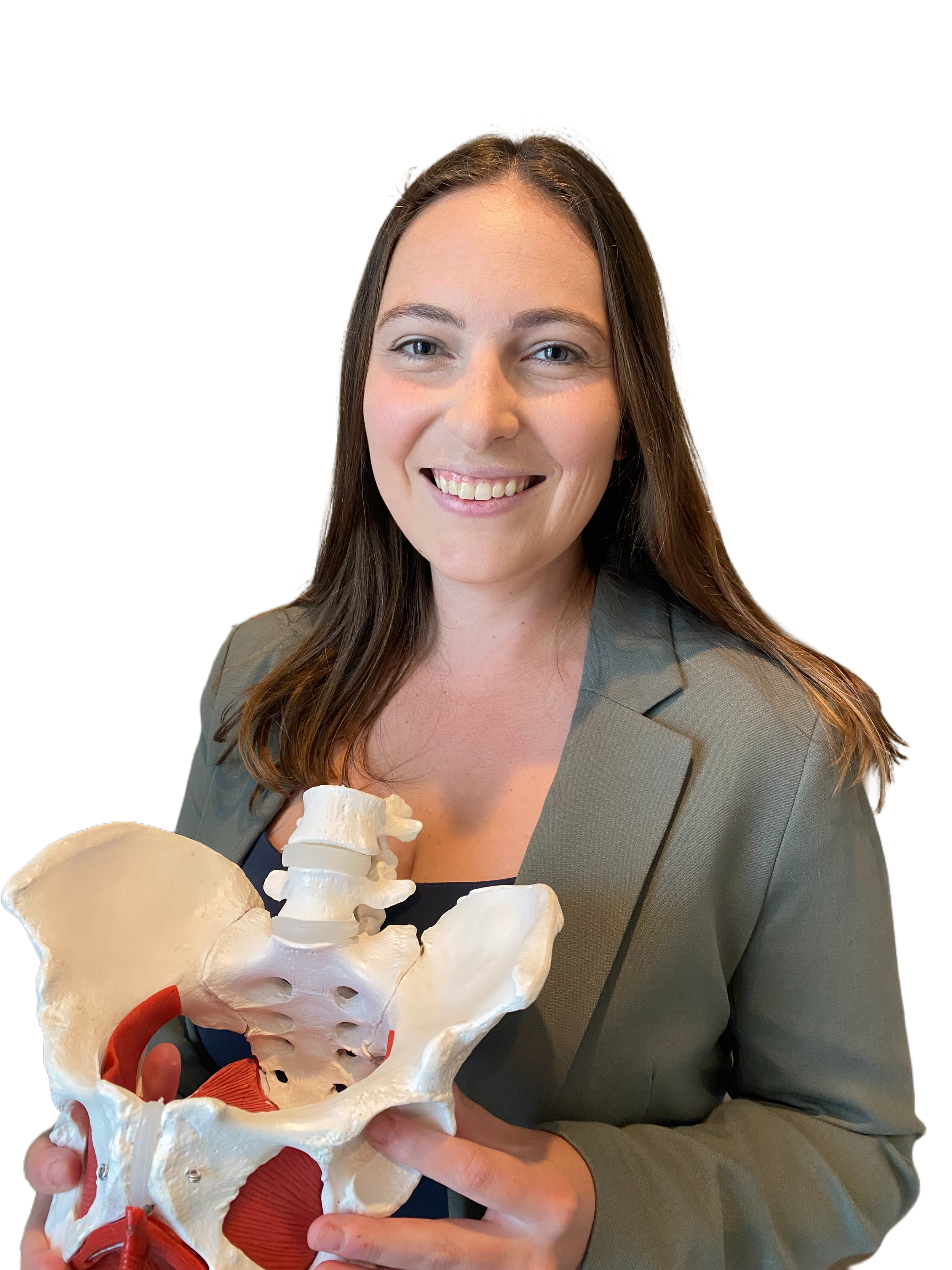 A woman with long brown hair, wearing a gray blazer, smiling and holding a medical model of a human pelvis and lower spine. Pelvic floor physical therapy. pregnancy, postpartum, and women's healthcare