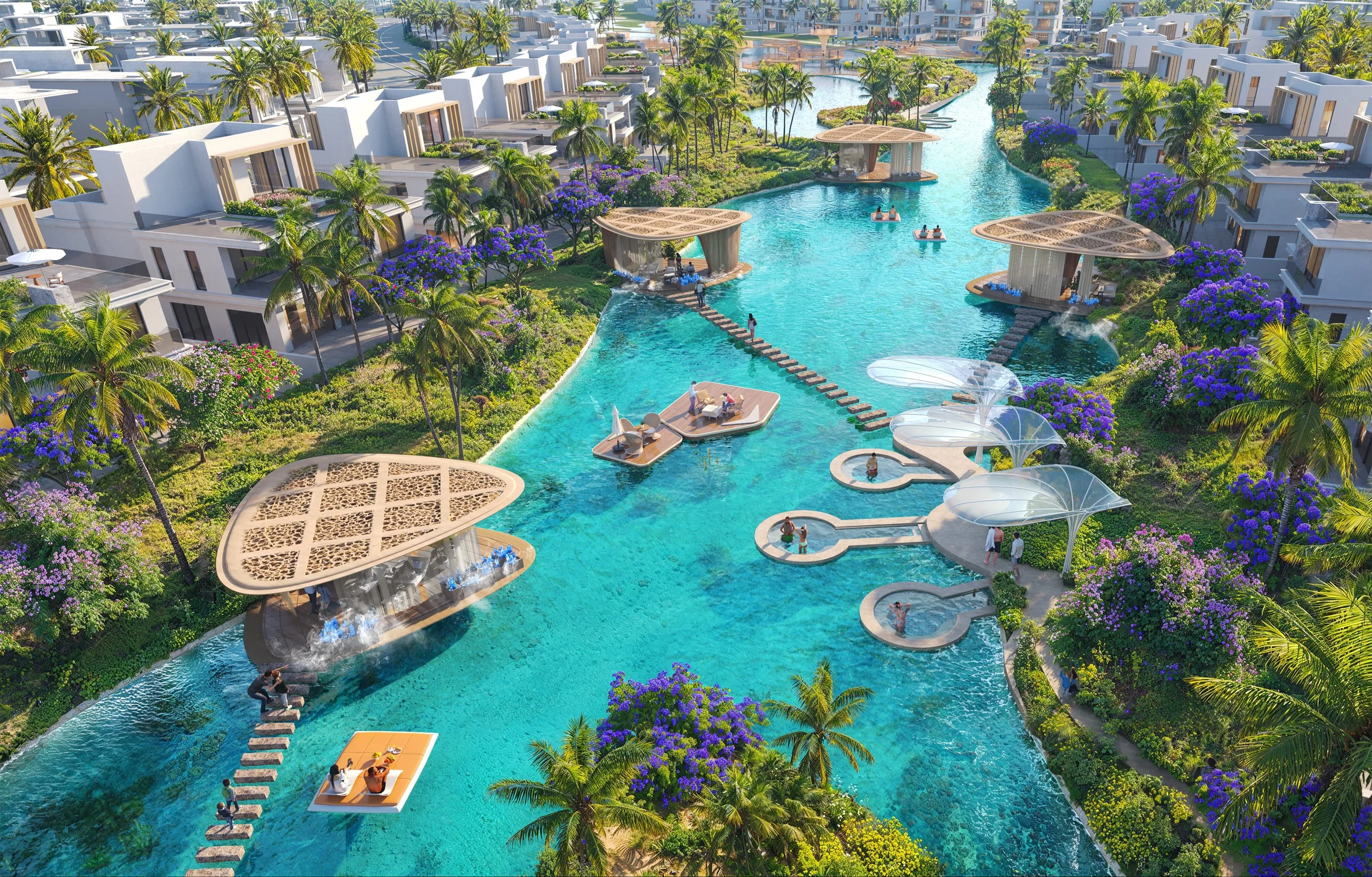 A luxurious resort with a winding lagoon-style pool, surrounded by palm trees, modern cabanas, and vibrant purple flowering bushes. People are relaxing on floating platforms, walking along pathways, and enjoying the scenery.