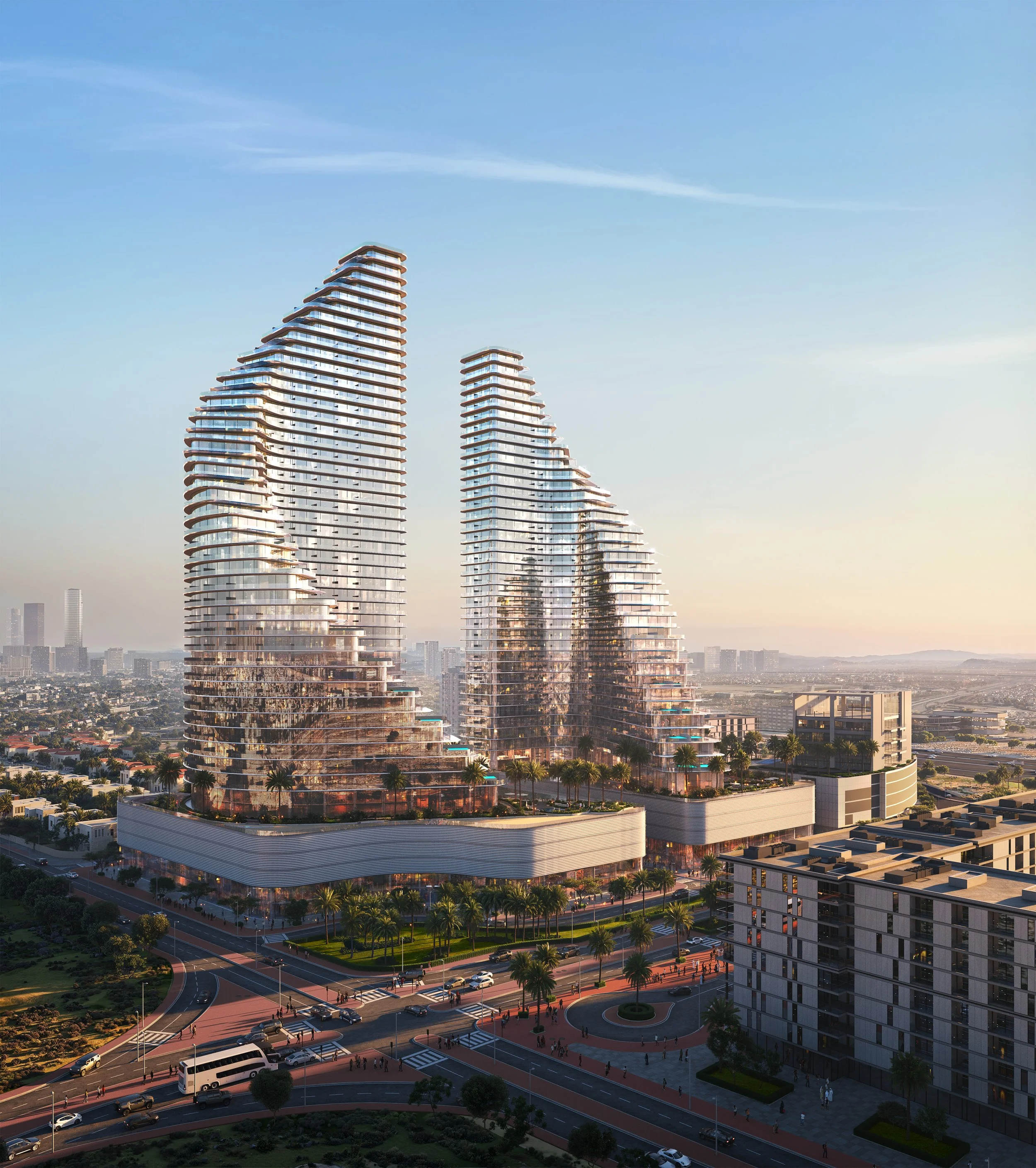 A cityscape featuring two modern, high-rise buildings with a twisted, layered design, set against a partly cloudy sky and distant city skyline.