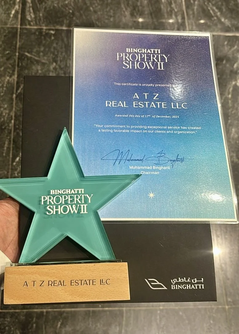 A certificate and an award star shaped trophy for BINGHATTI PROPERTY SHOW II, awarded to A T Z REAL ESTATE LLC, also featuring a signature and date of December 17, 2025, on the certificate.