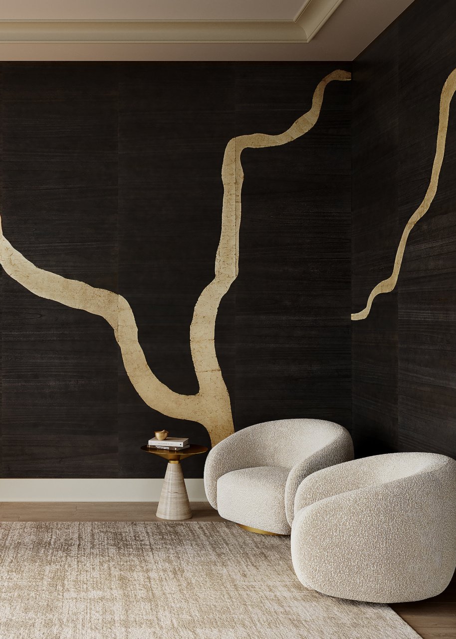 Modern living room corner with textured beige armchair, small round side table, dark textured wall with abstract beige lines, beige rug, and crown molding ceiling.