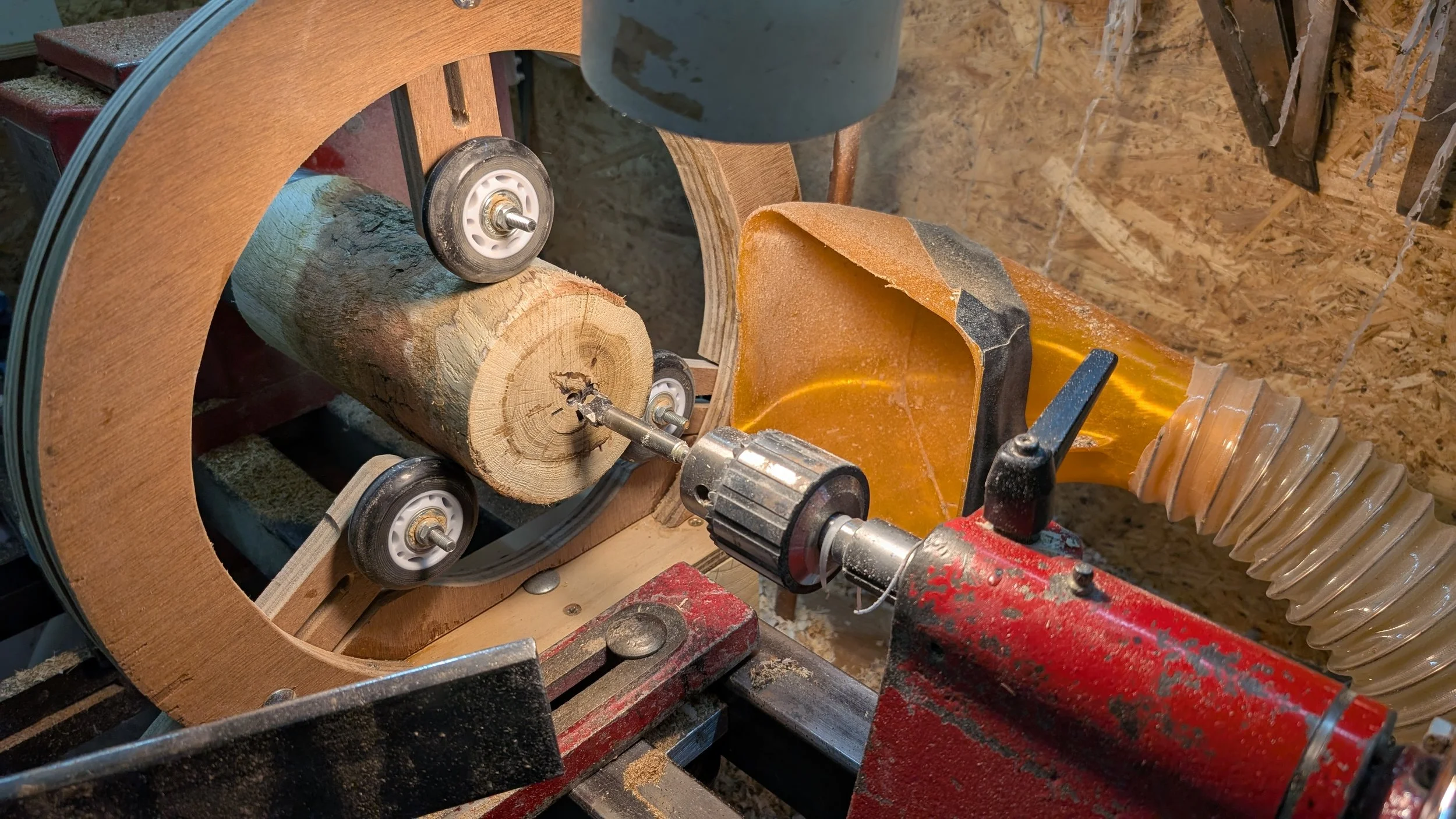 Long thin pieces, like this vase, need the use of a steady rest to help support them and reduce vibration. I made this one using plywood and roller blade wheels.