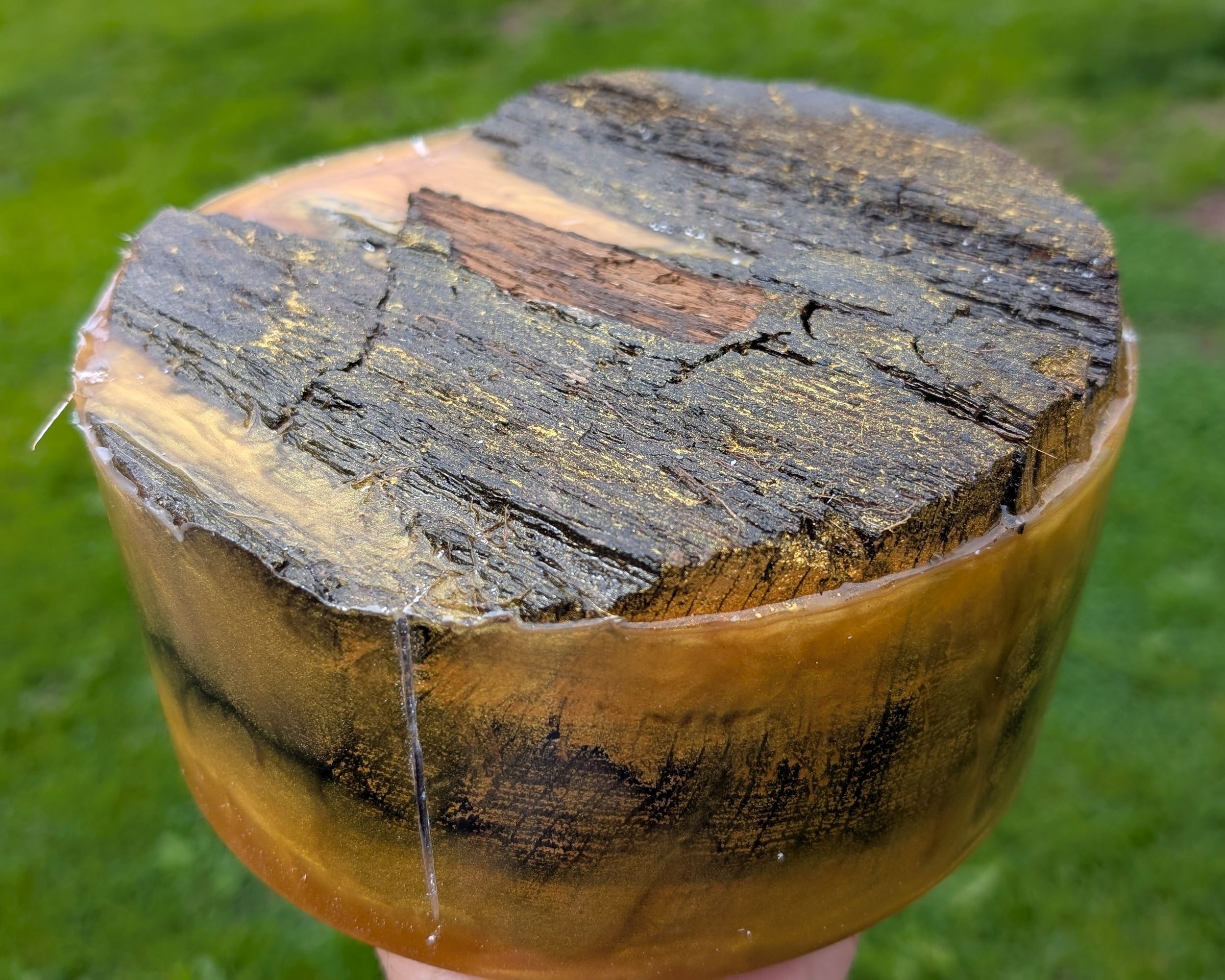 Freshly out of the pressure pot, with gold resin in every crack and defect.