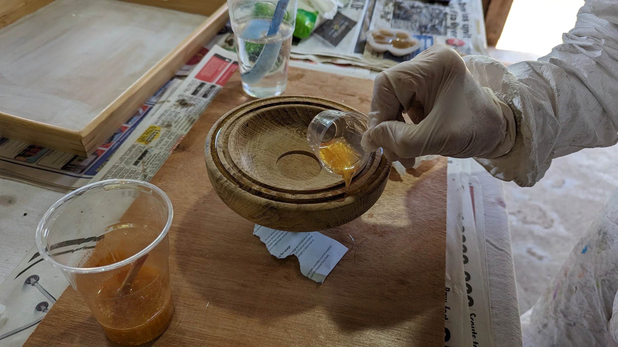 A small oak bowl having resin added to feature rings in the top face.