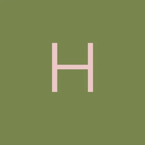 A pink letter H on a green background.