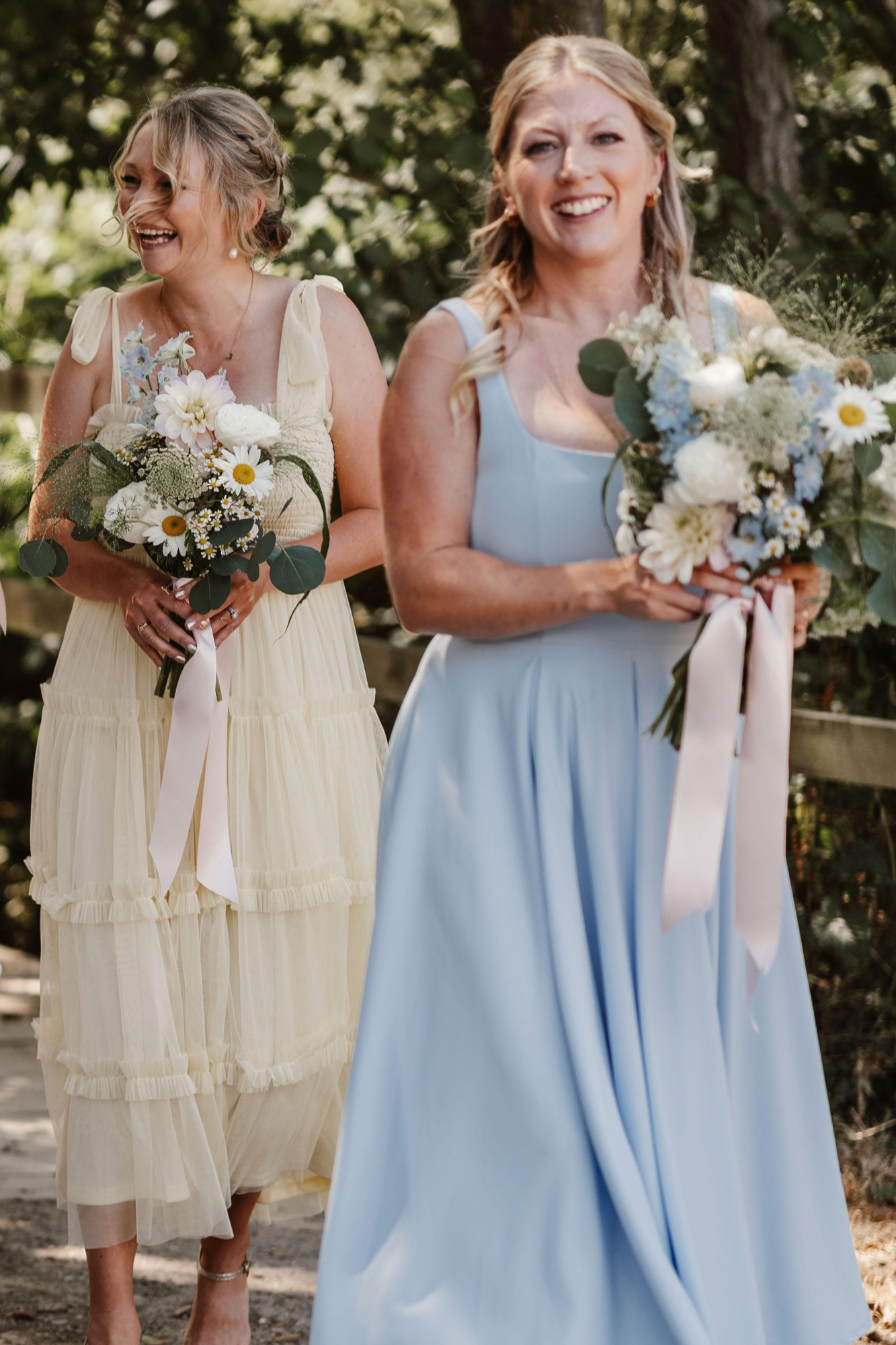 Pastel blue and pink bridesmaid bouquets for a festival wedding in Sussex