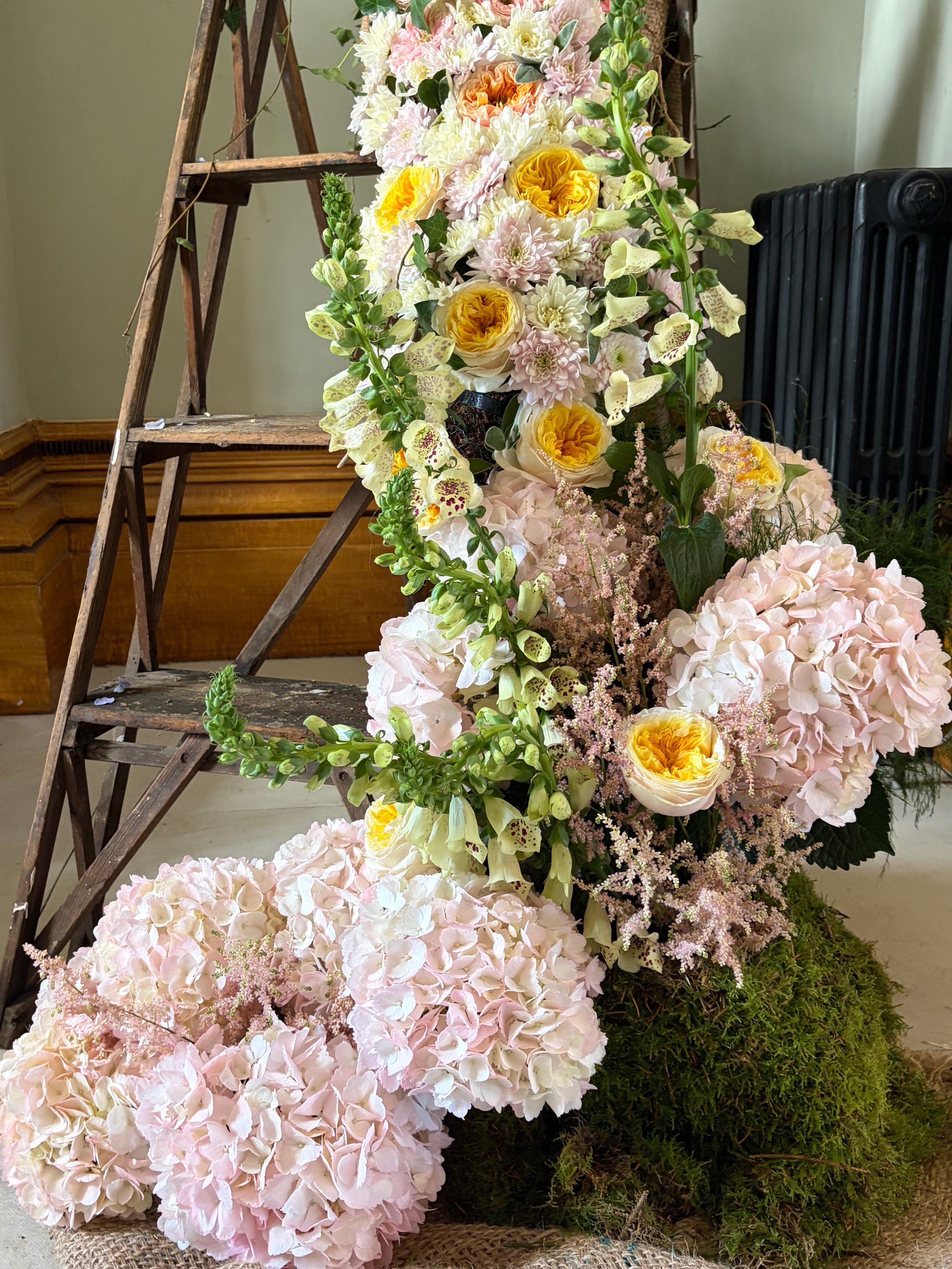 ladder_floral_installation_using_pink_hydrangea_foxgloves_and_garden_roses_flowers_Brighton_Regency_Townhouse.jpg