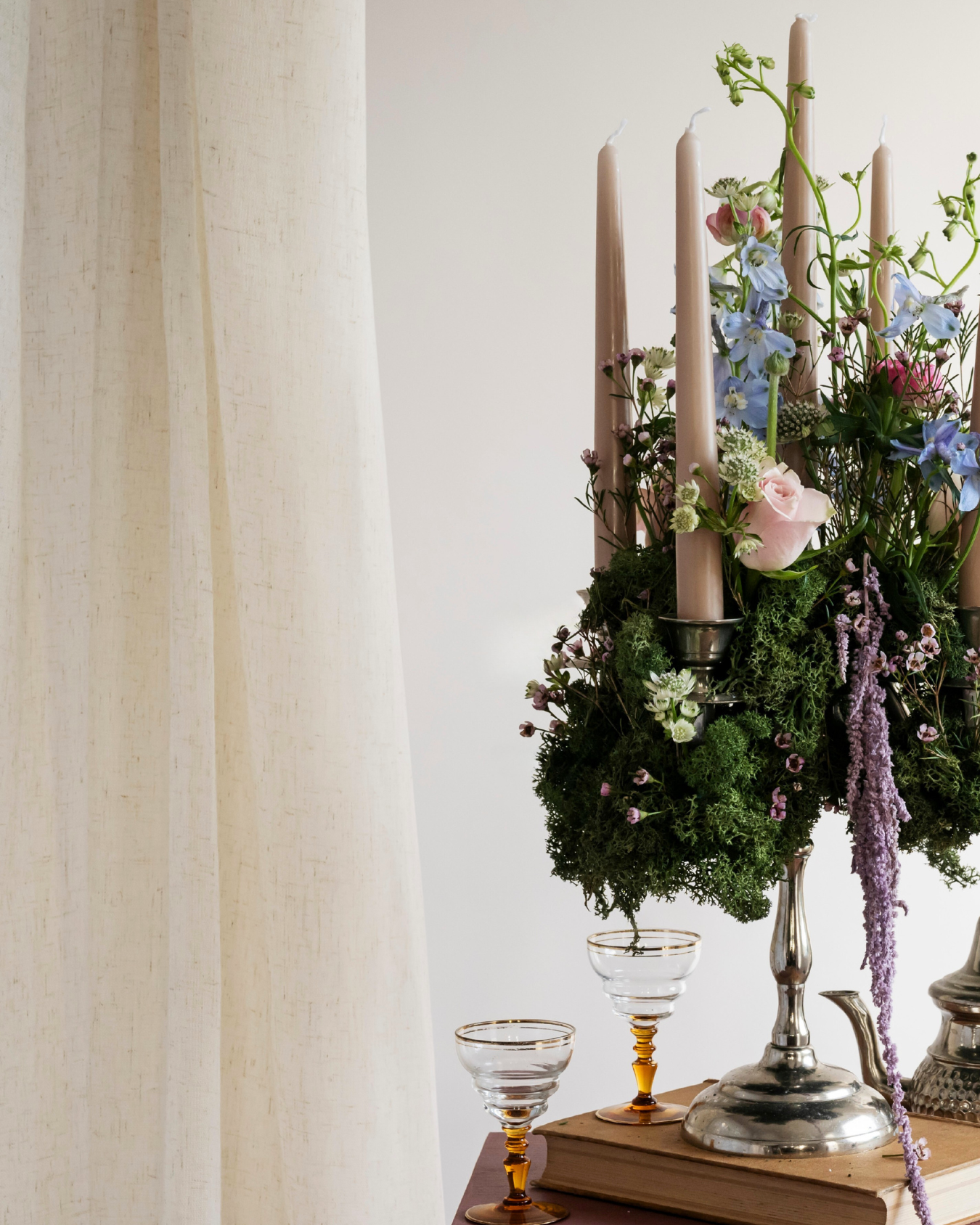 colourful flowers seen on a silver candelabra for an event display
