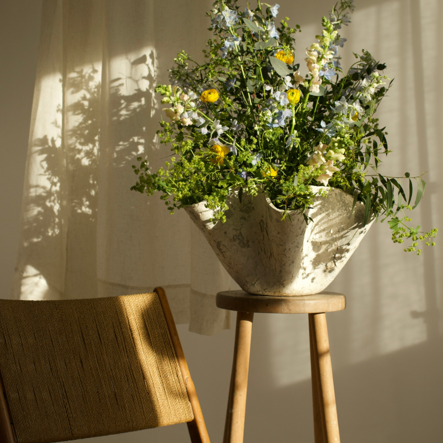 flowers arranged in a Willy Guhl tissue planter