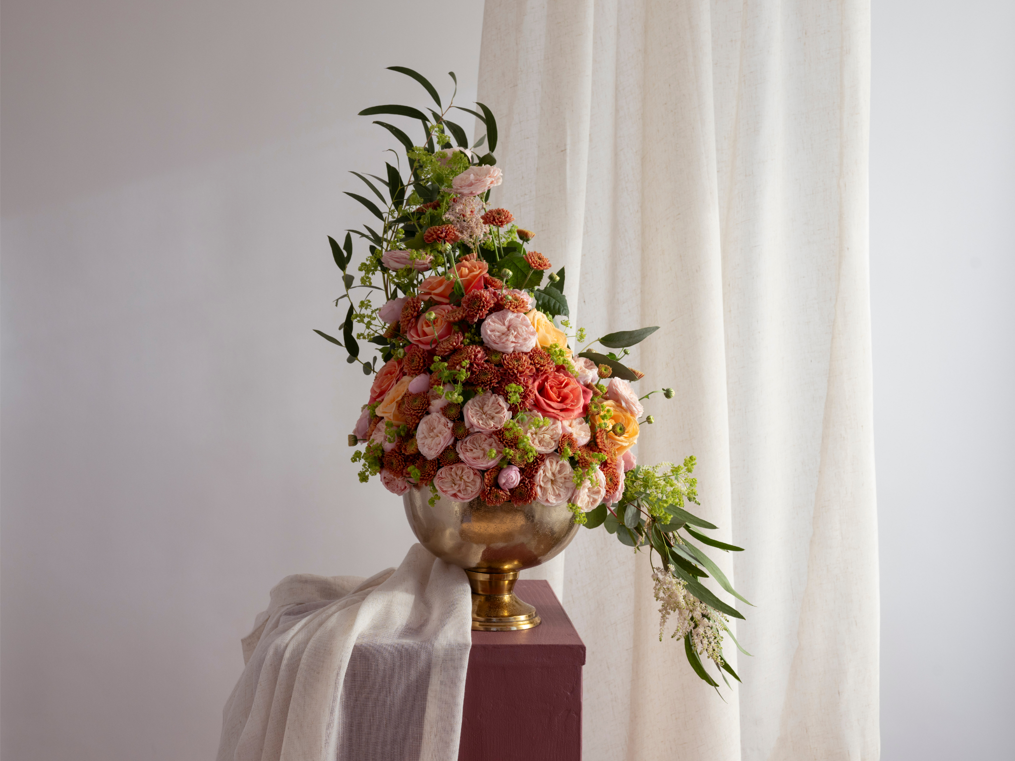 a flower arrangement on a pedestal inspired by Marie Antoinette