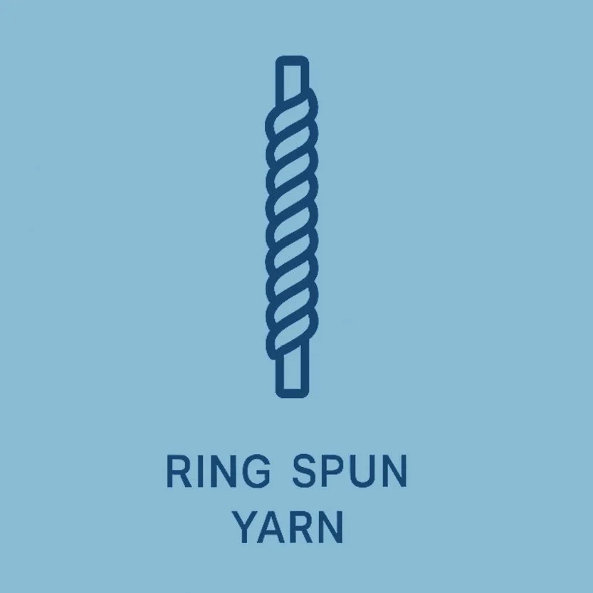 Close-up of a piece of blue denim fabric folded in a spiral.