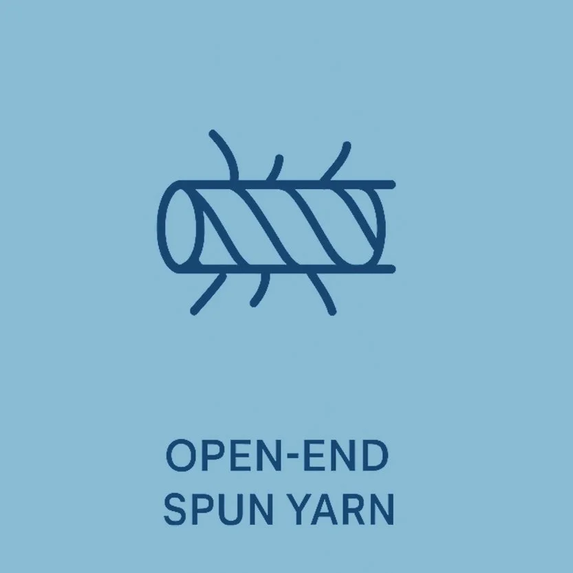 Close-up of dark blue denim fabric with a textured weave.