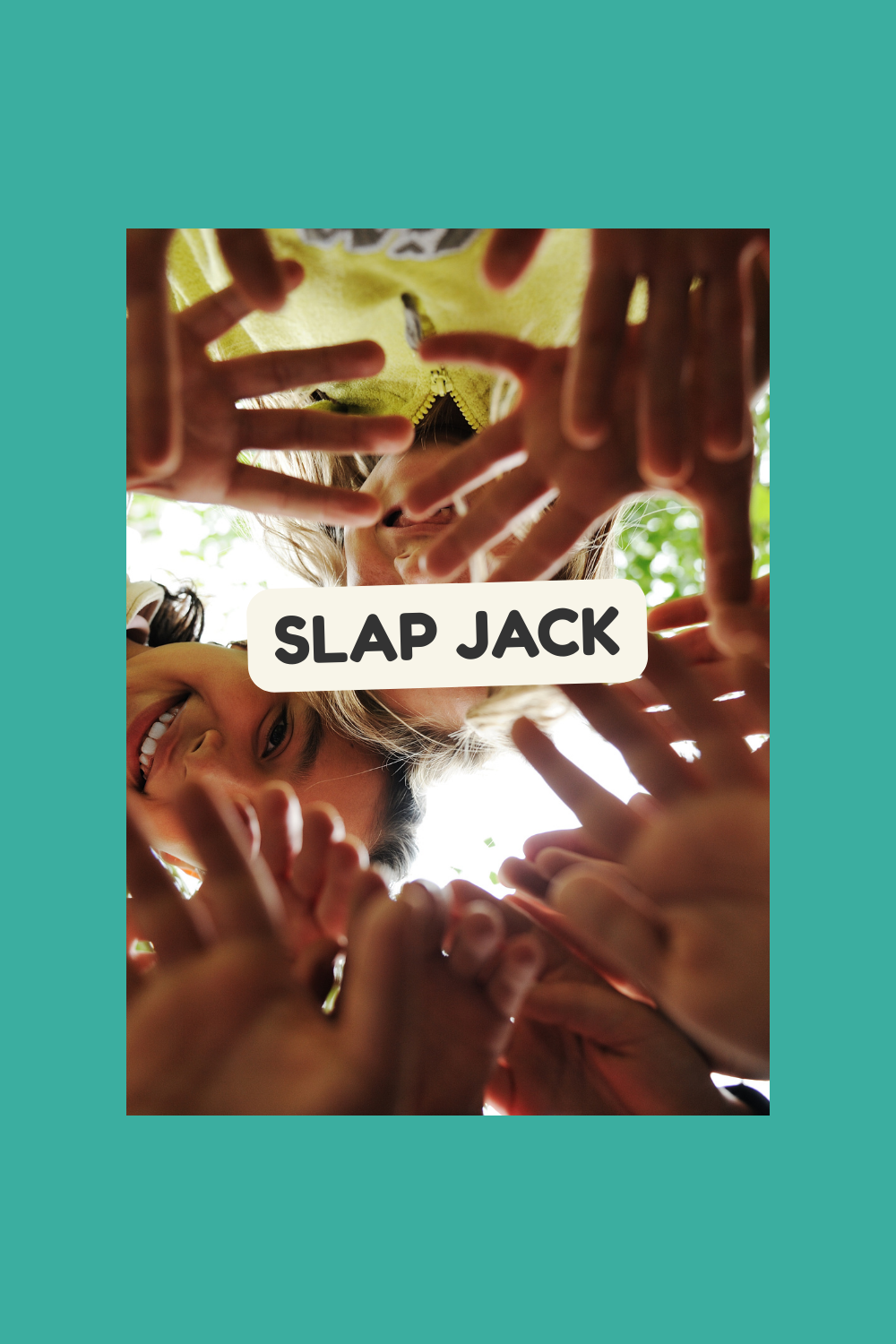 Children playing outdoors, forming a frame with their hands around a girl's face, smiling, with the words "SLAP JACK" overlaid.