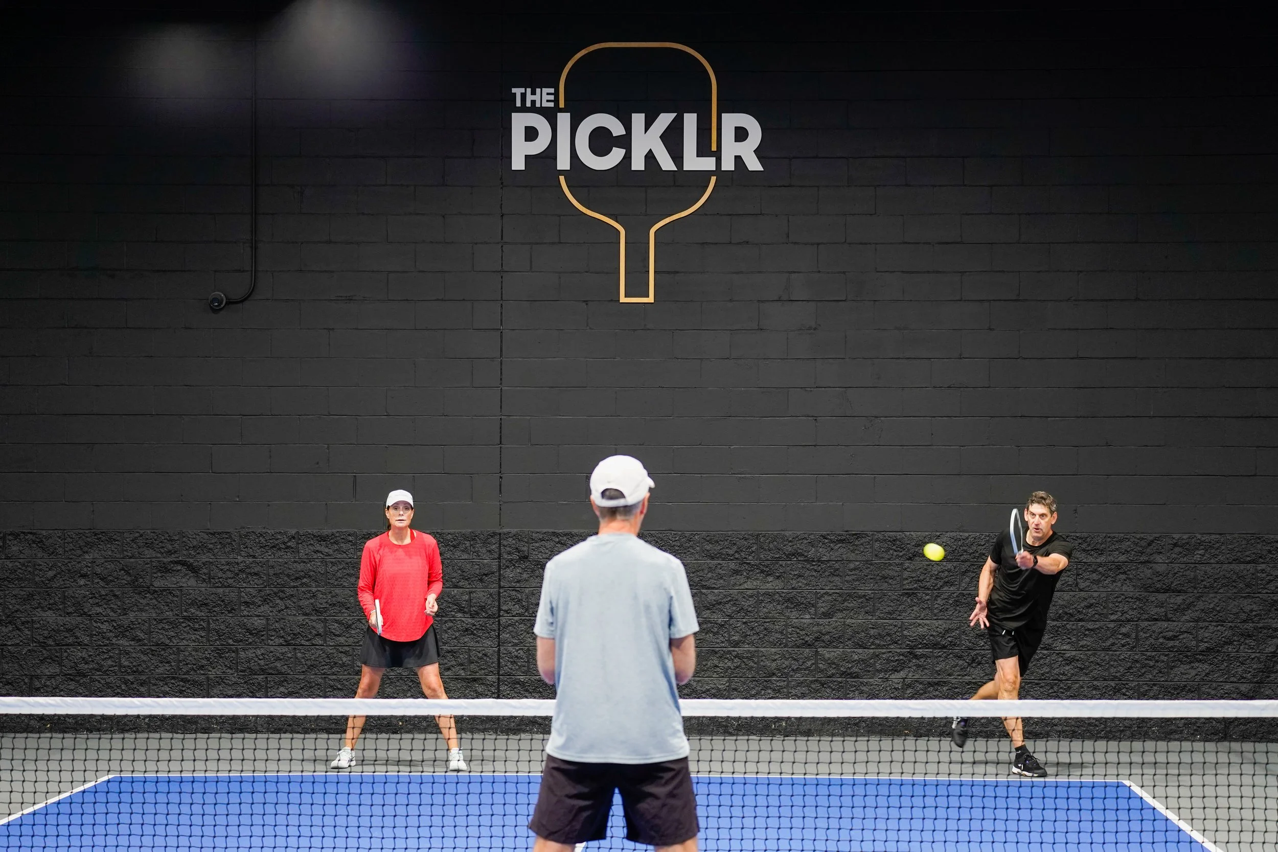 Jess Wilk, left, plays pickleball with her brother, Jon Wilk, right, at the LBI 2025 Pickleball by the Beach Tournament at the Picklr in Manahawkin, NJ on August 2, 2025. (Follow South Jersey)