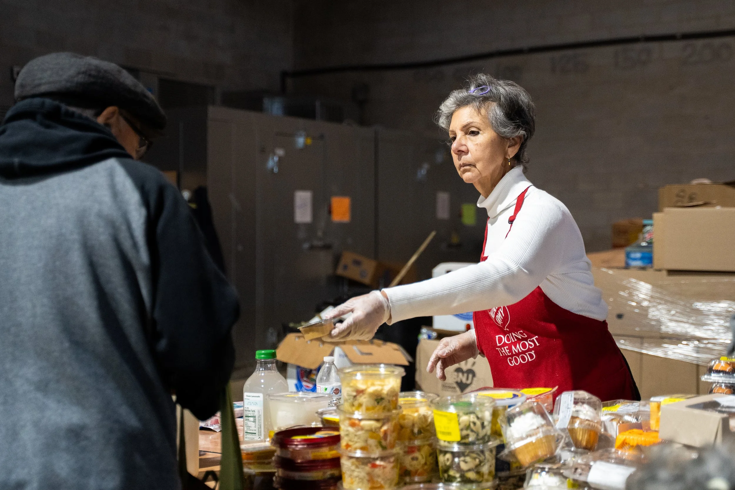 Leslie Santana hands out food at the Salvation Army turkey distribution in Vineland, NJ on Monday, November 24, 2025. (The Star-Ledger)
