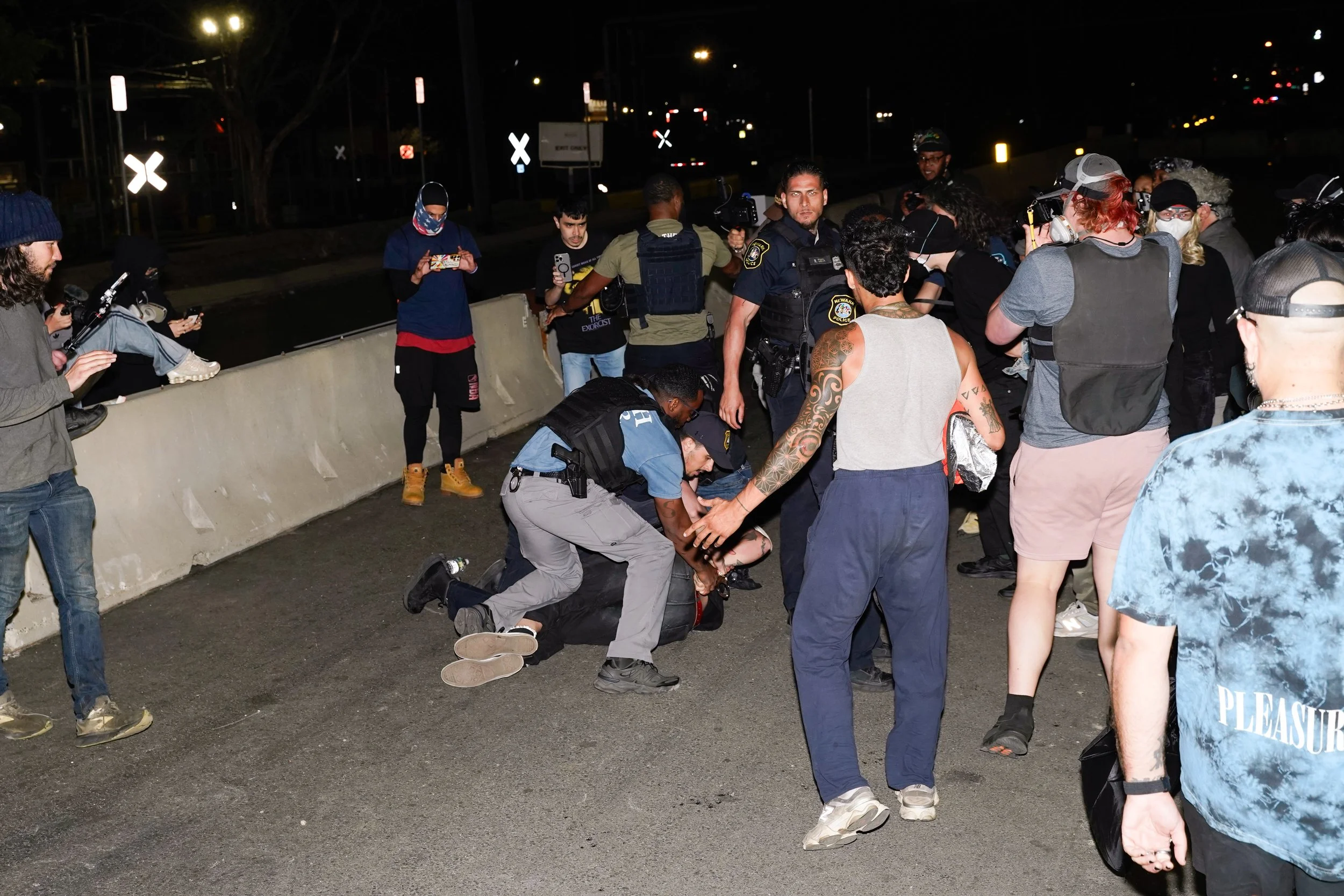 Newark police arrest a protester at Delaney Hall in Newark, New Jersey on Sunday, June 7, 2026. (NJ.com unpublished)