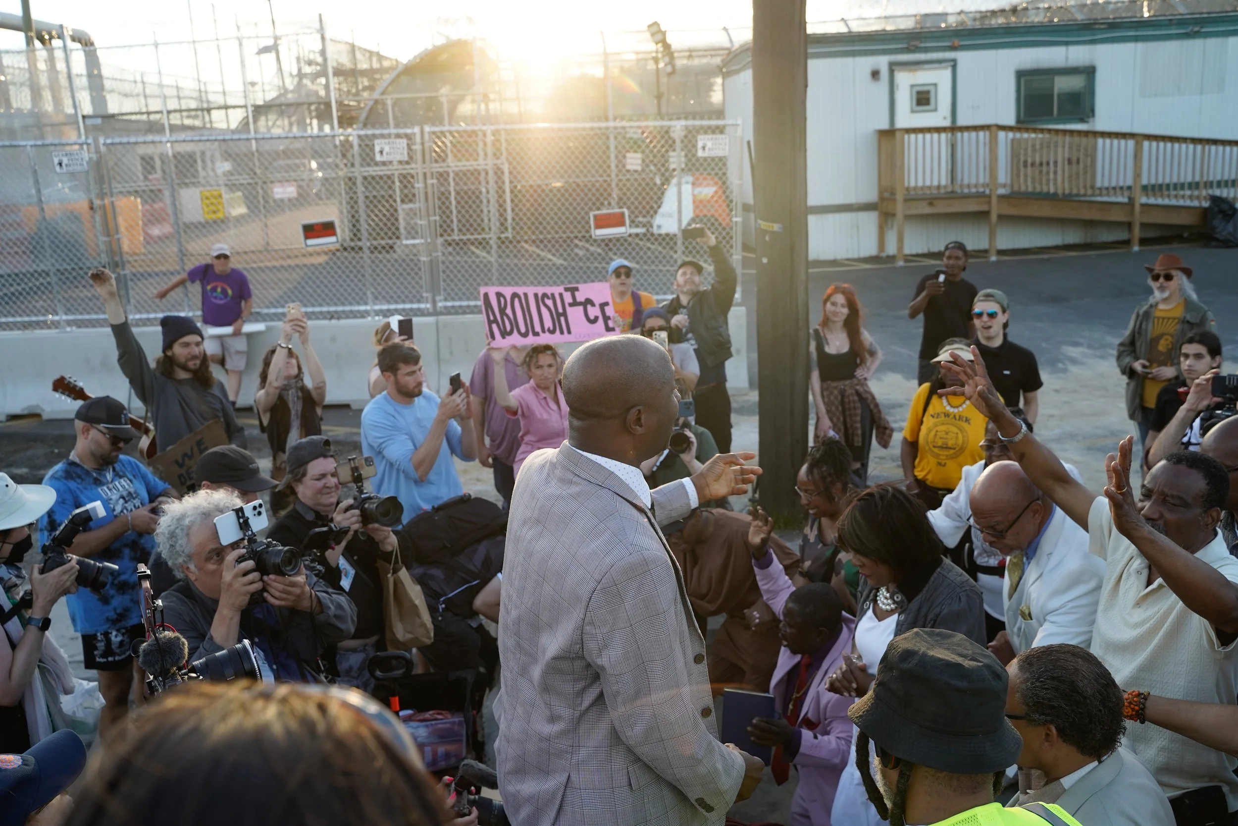 A church leader from the Newark Interfaith Alliance prays outside of Delaney Hall in Newark, New Jersey on Sunday, June 7, 2026. (NJ.com unpublished)