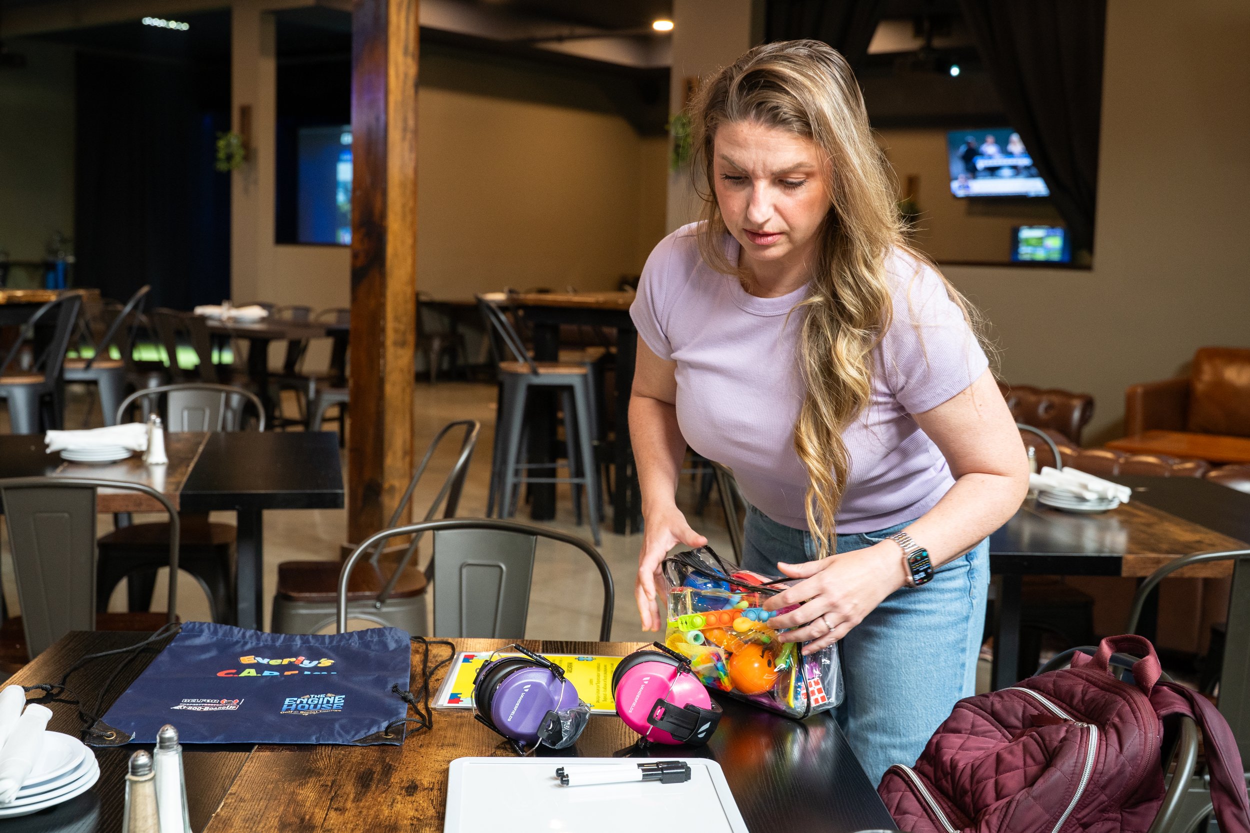 Founder Lindsay Breslin removes items from an Everly's CARE Kit at The Engine House in Pennsville, New Jersey on Friday, July 17, 2026. (NJ.com)