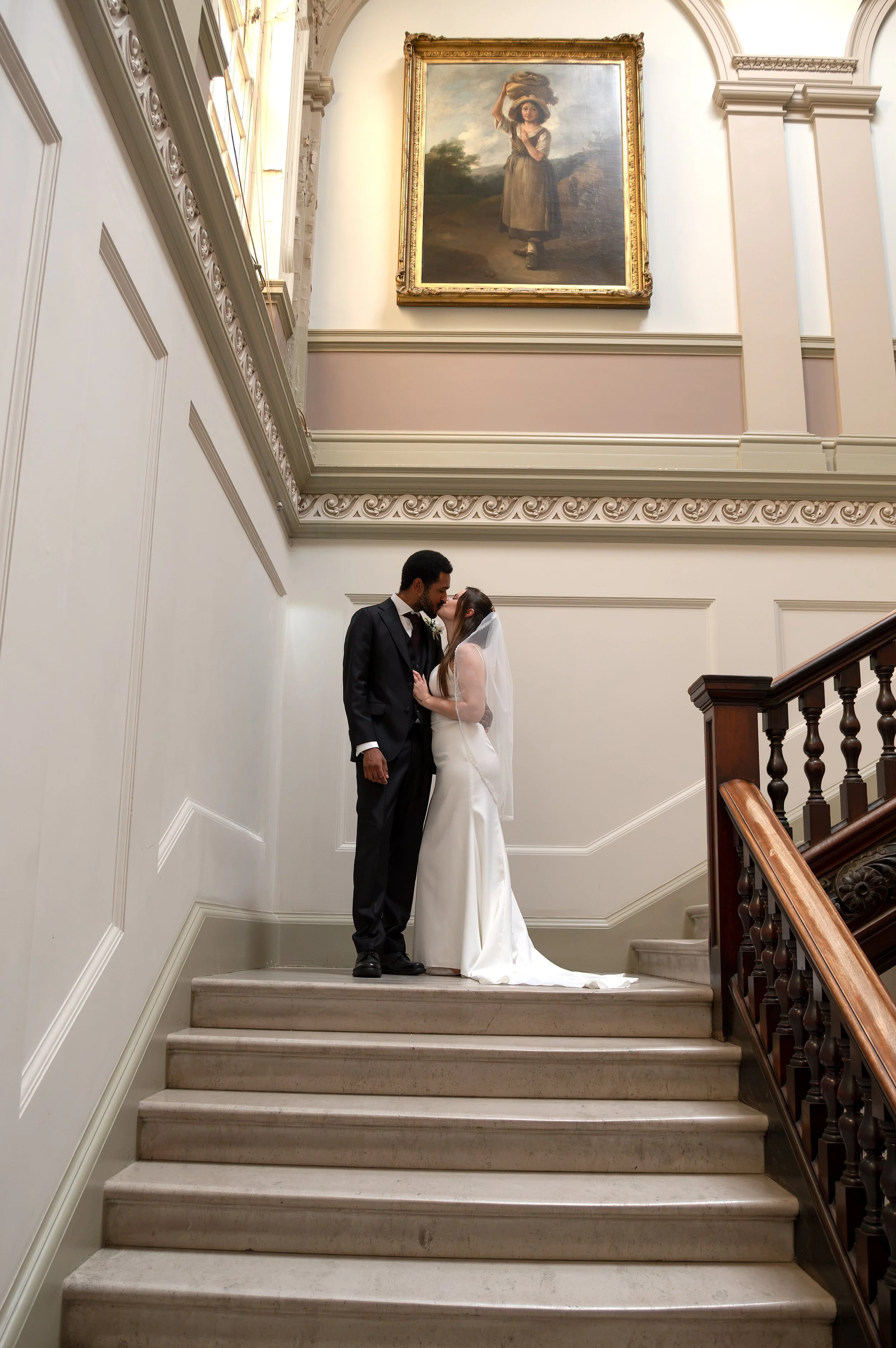 A wedding couple of the famous staircase in the Guildhall Bath