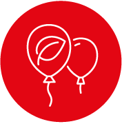 Two balloons, one with a leaf design, against a red background.