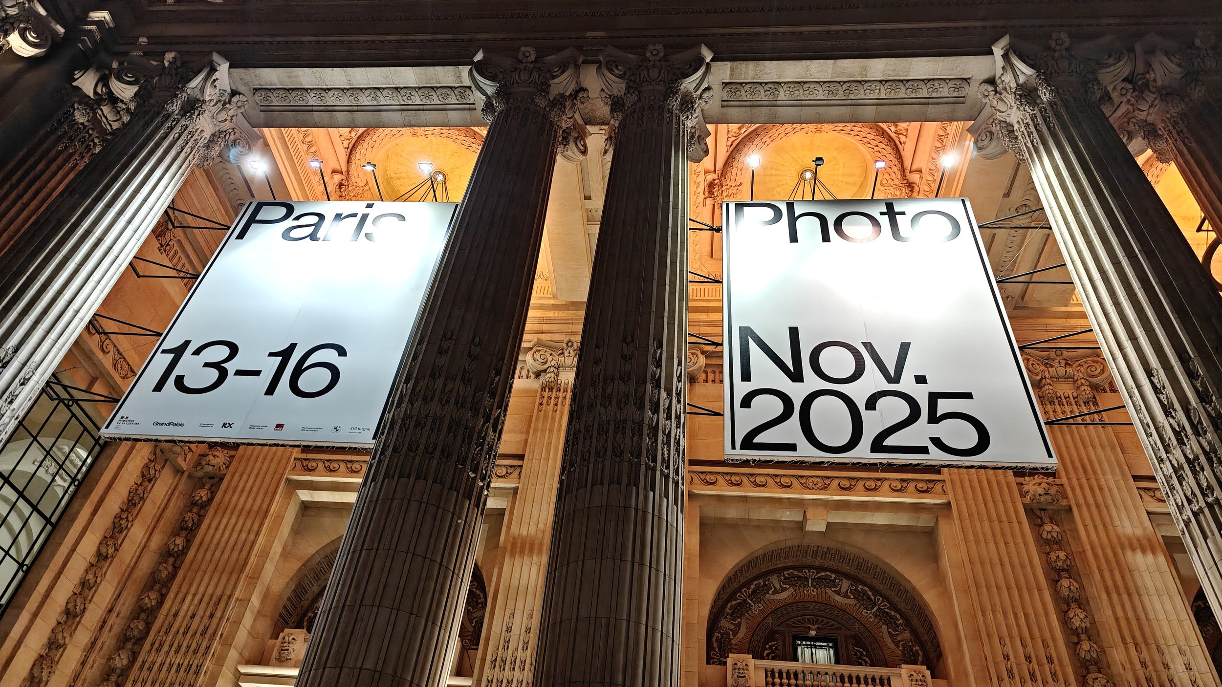 Signs above The Grand Palais advertising Paris Photo Fair 2025, France.