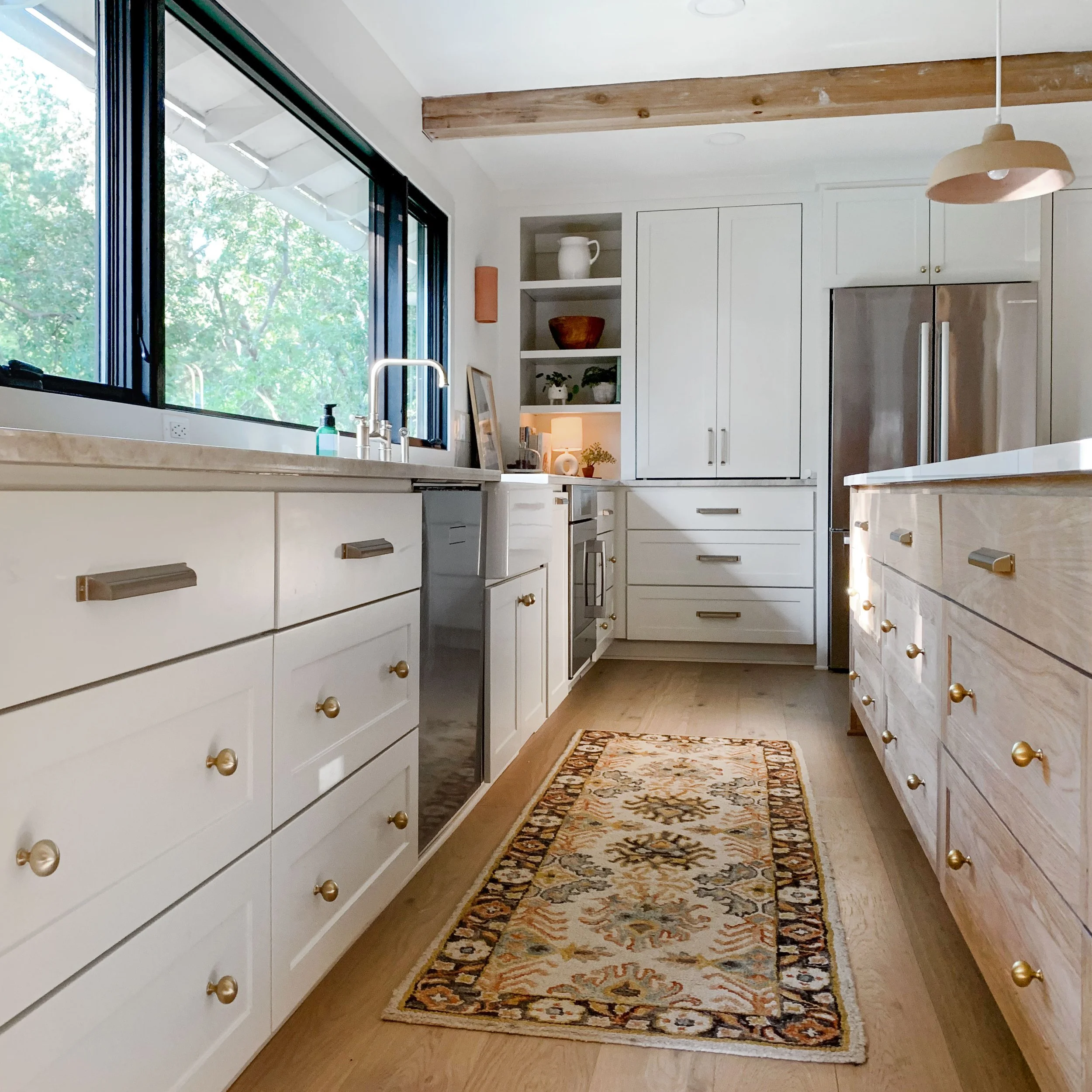 Kitchen hardware, old Leawood Kansas. Painted shaker cabinets with plain-sawn white oak island.