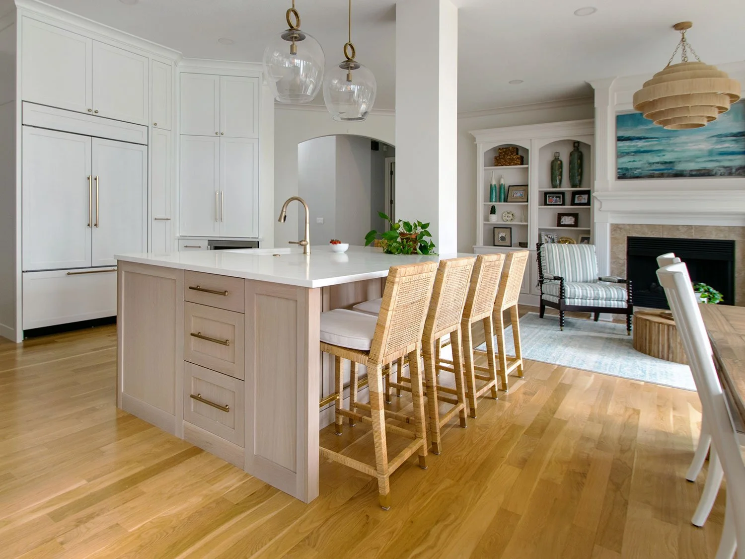Plain-sawn white oak kitchen island with quartz countertops and seating.