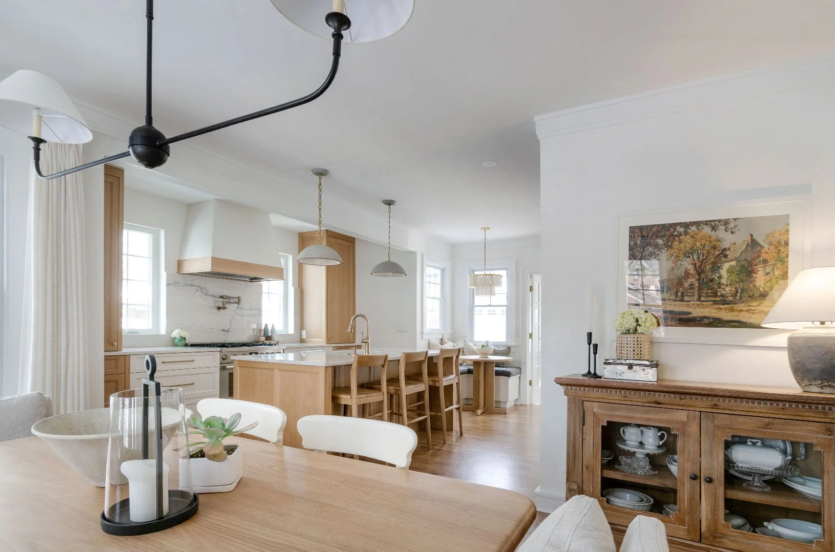 Whole-home design and remodeling in Kansas City featuring an open kitchen, dining, and living space with custom cabinetry and cohesive finishes.