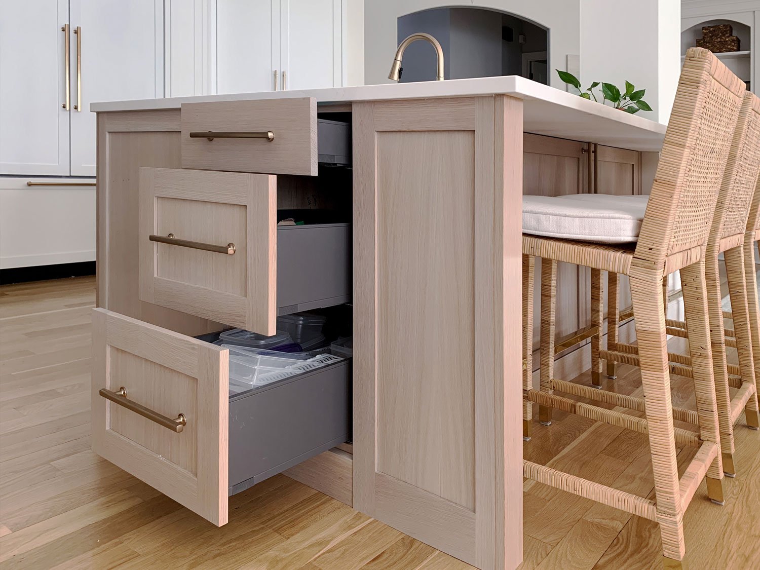 Plain sawn white oak cabinetry island with end storage.