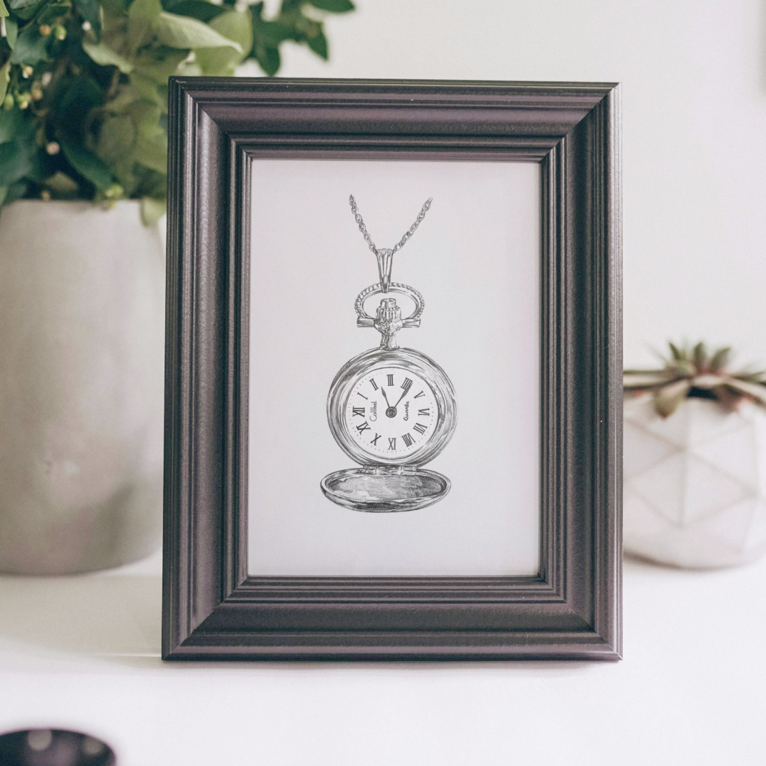 A framed commission drawing in black-and-white pencil of a realistic pocket watch with Roman numerals, hanging from its chain.