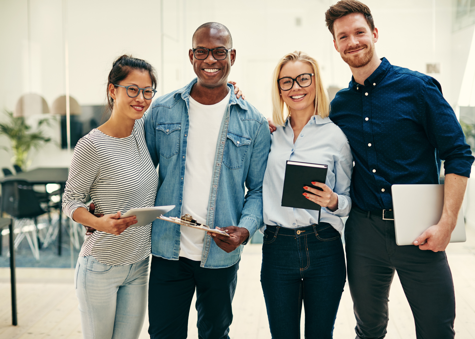 Family standing in front of their new roof installed by Tank Roofs in Perrysburg, Ohio.