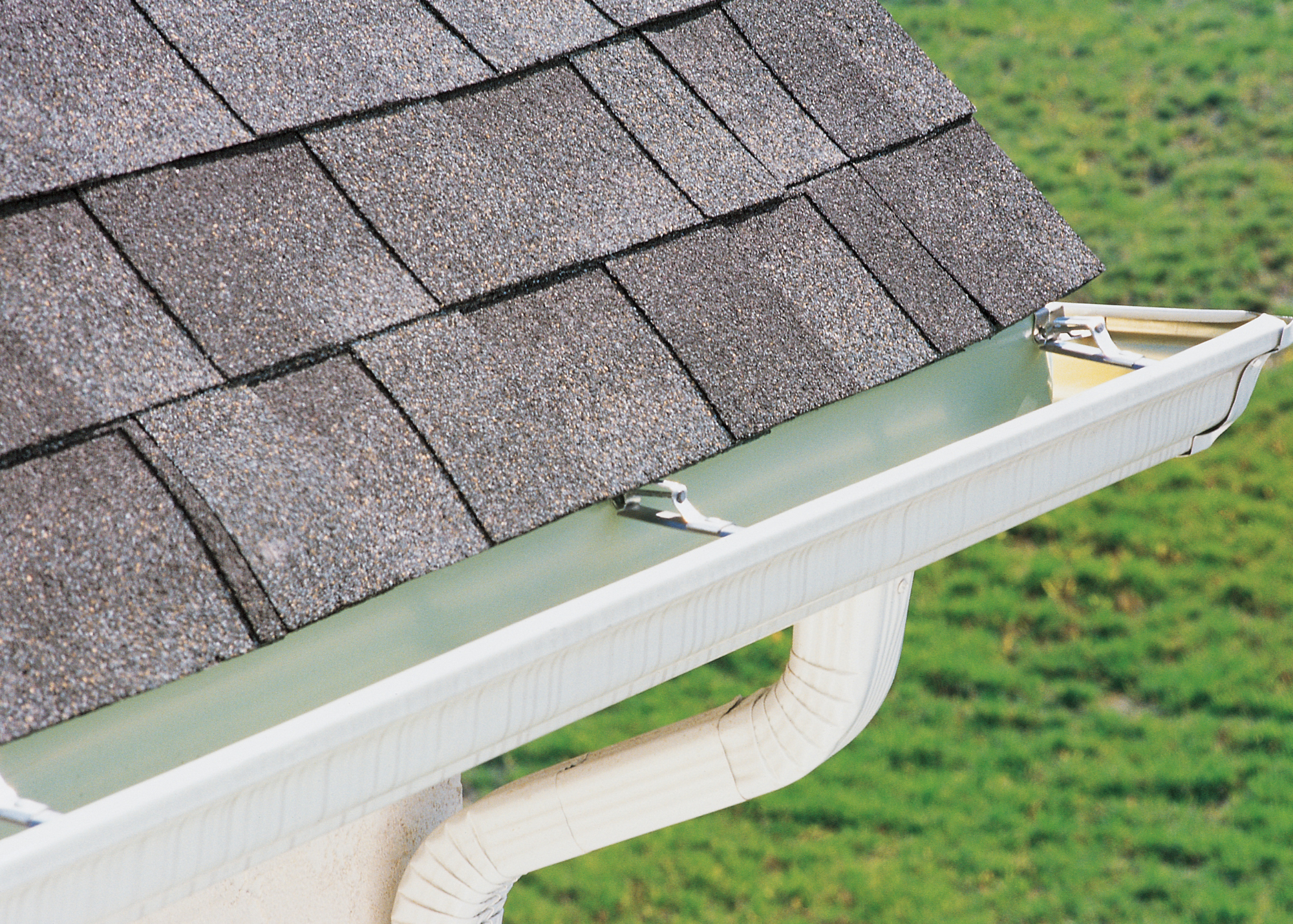 Close-up view of seamless gutter system installed by Tank Roofing